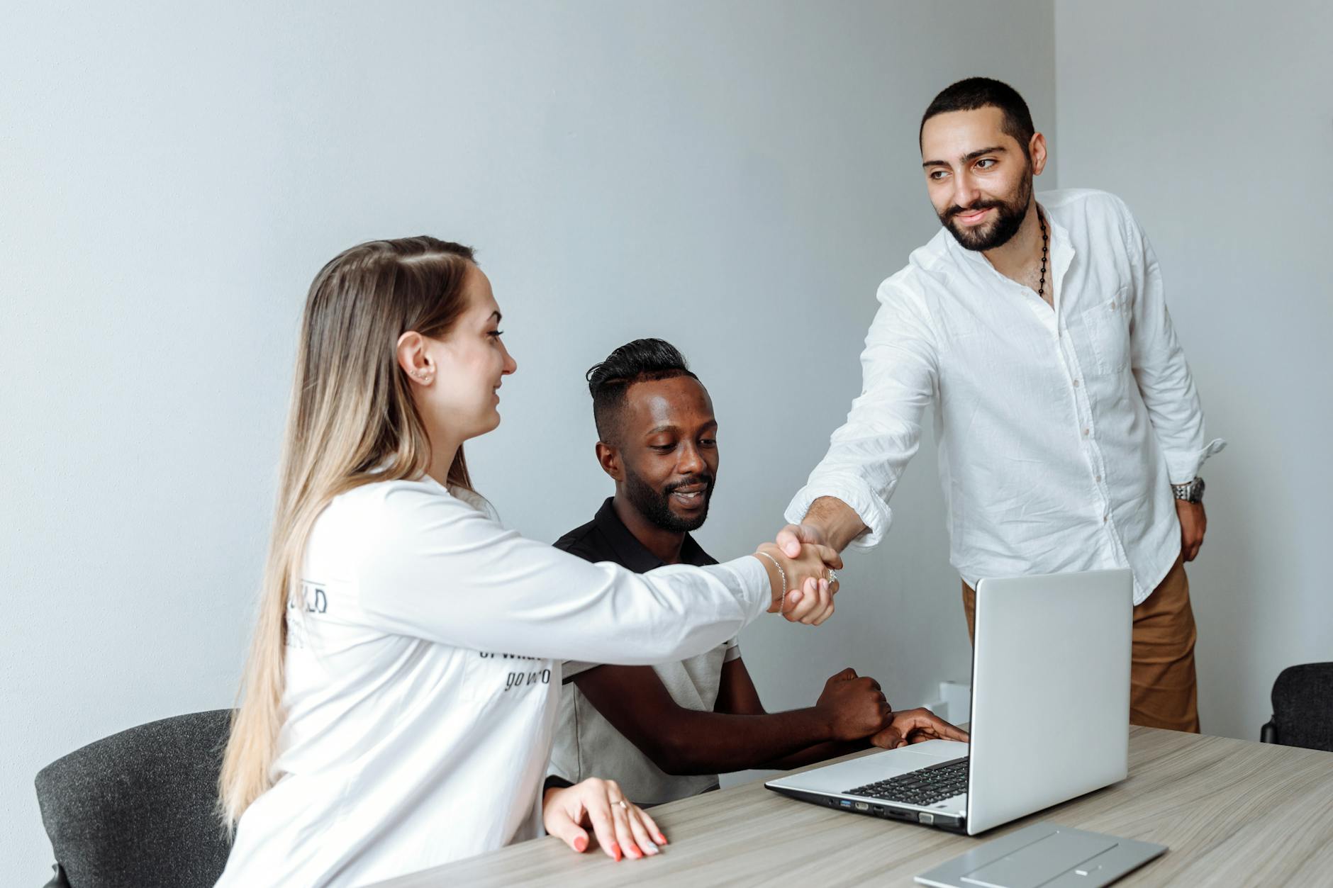 Business handshake for Trondheim sales follow-up planning.