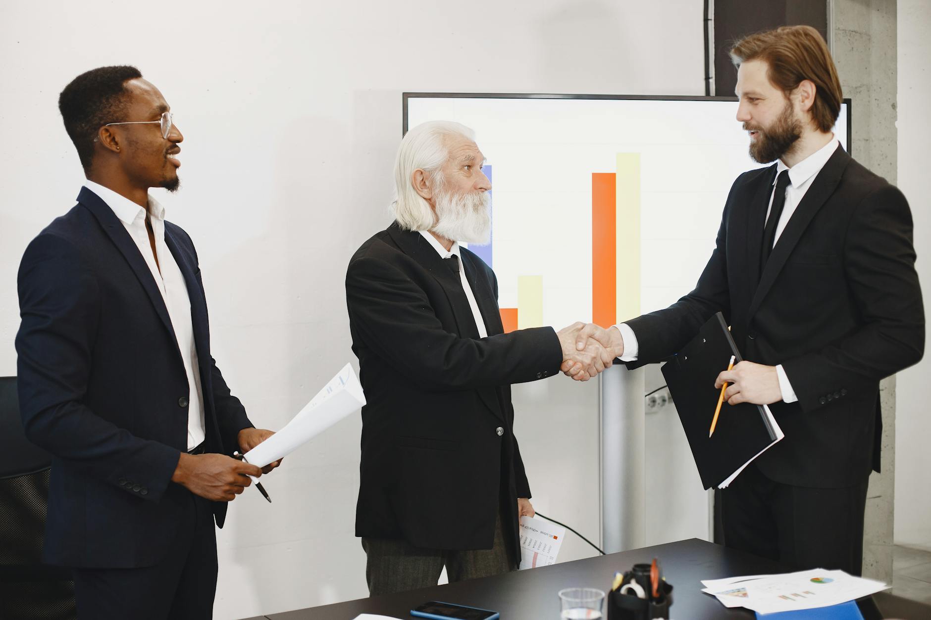Business handshake for Trondheim sales travel planning.