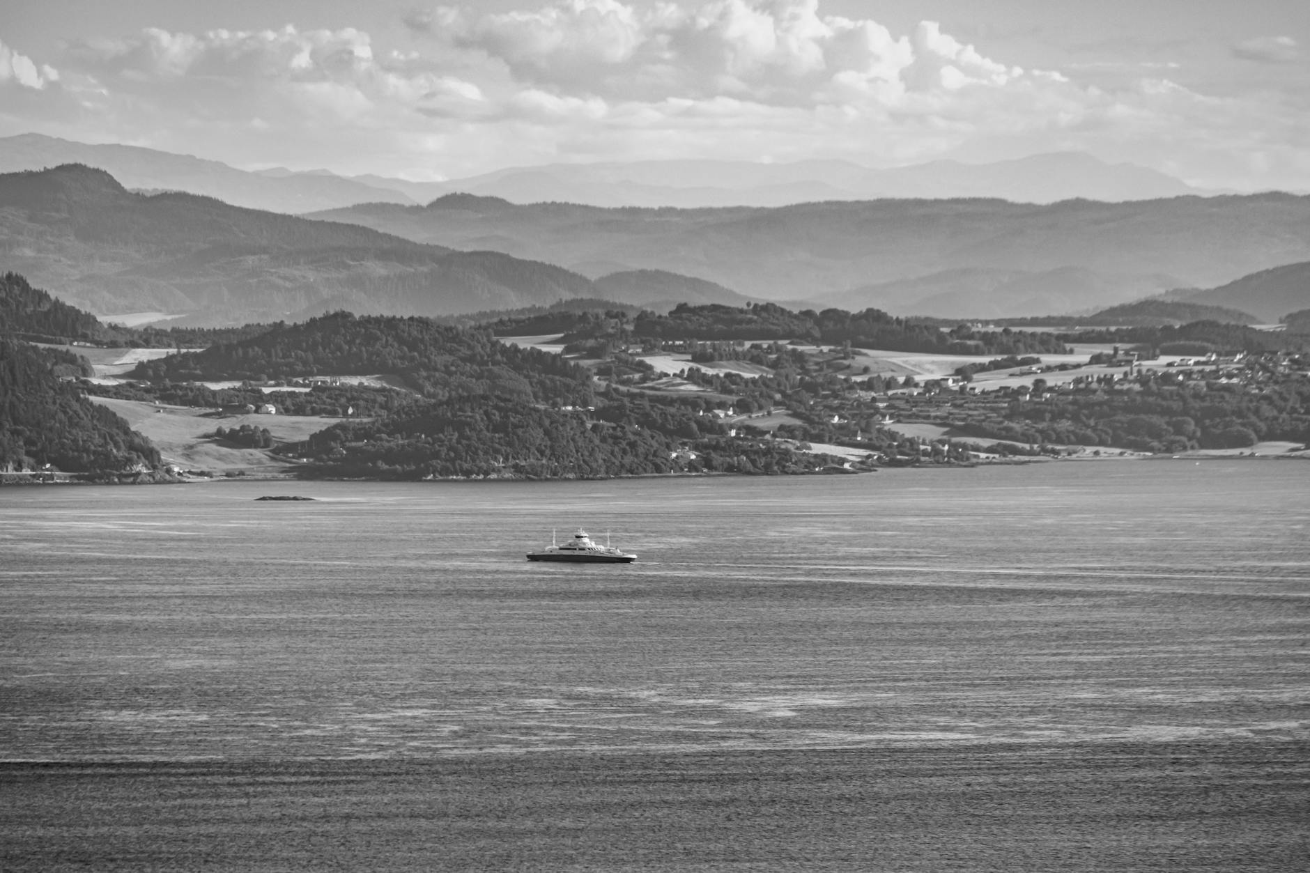 Boat on a Norwegian fjord for Trondheim waterfront route planning.