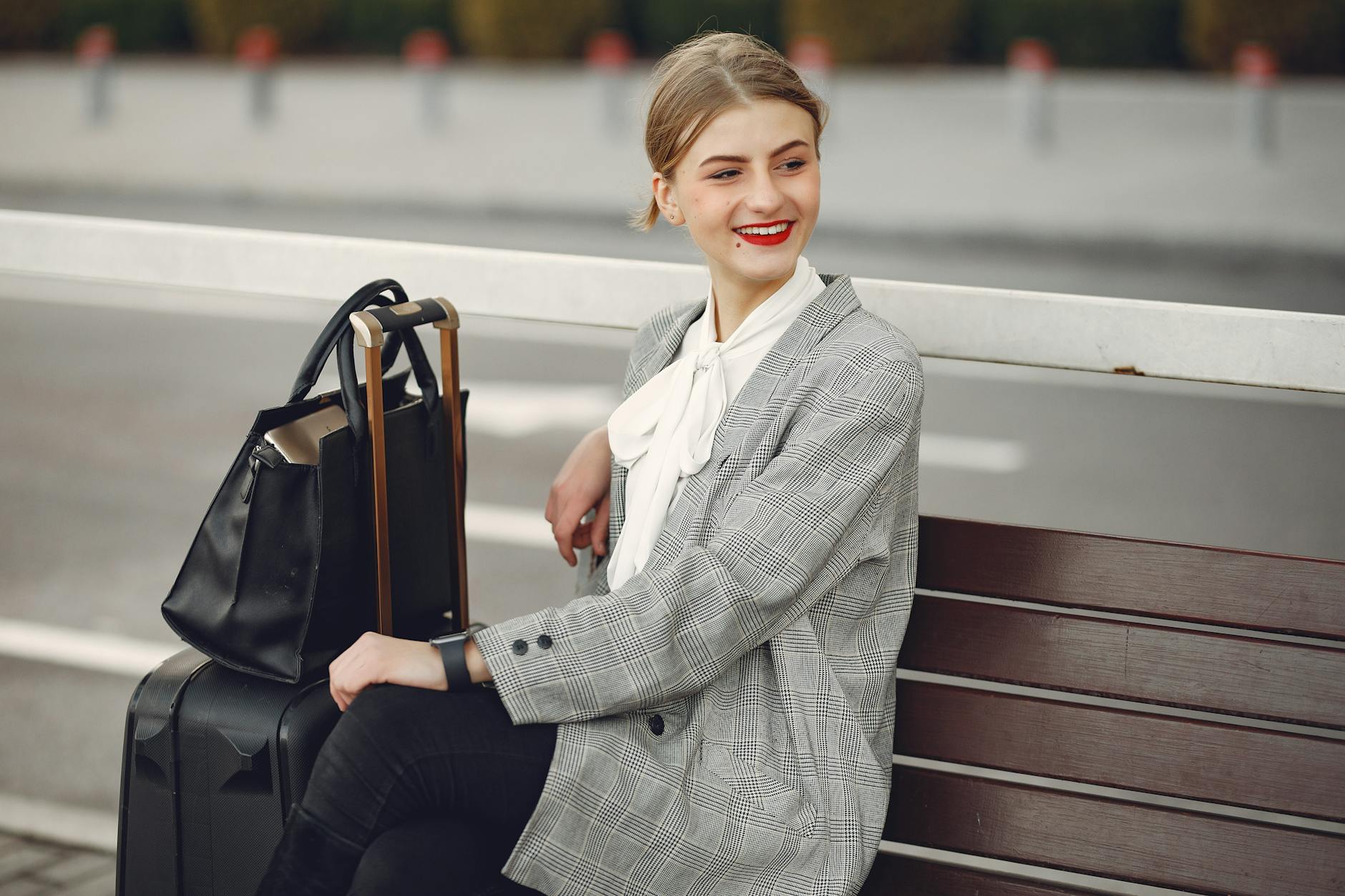 Traveler sitting with luggage for Trondheim baggage planning.