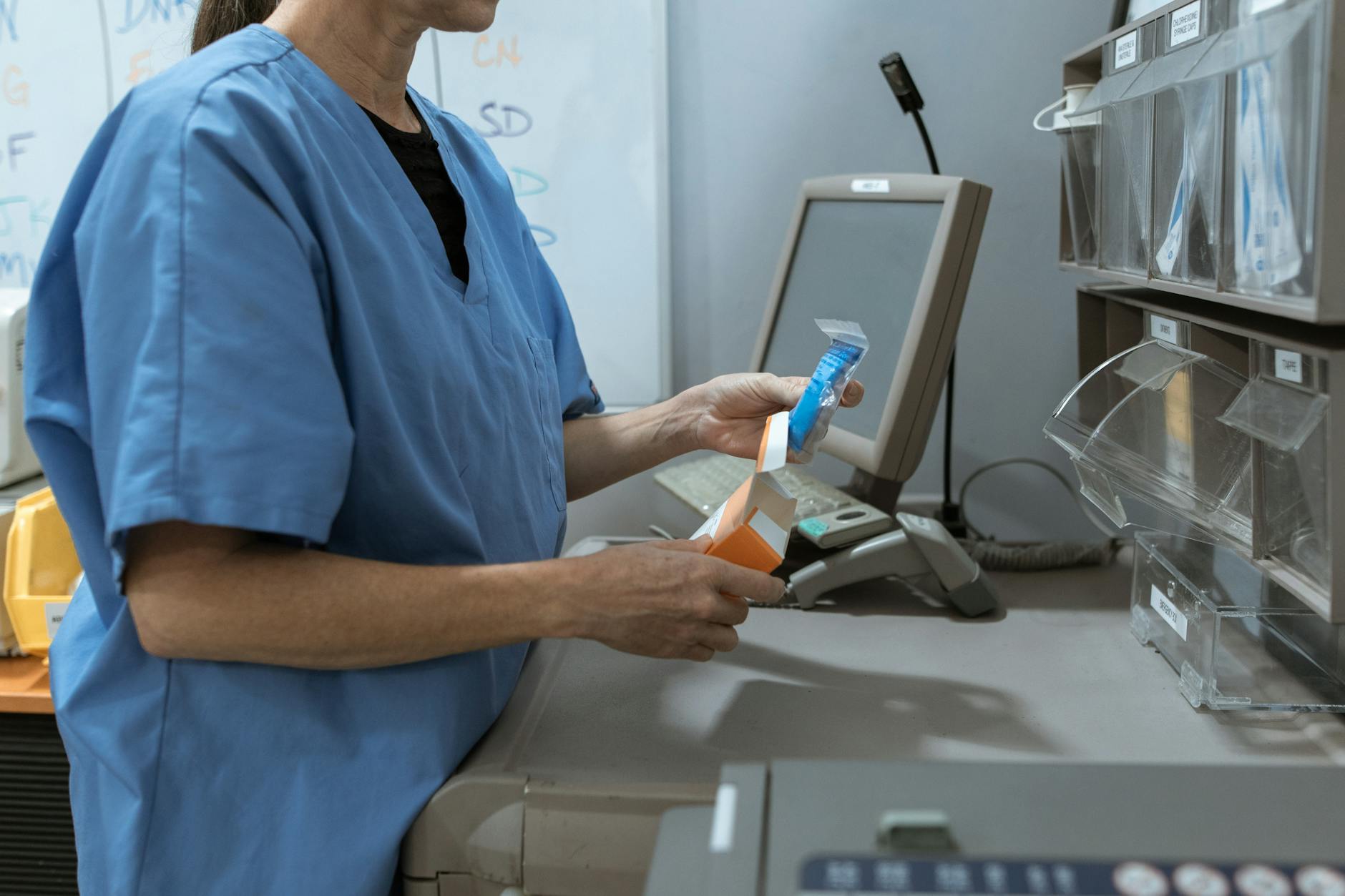 Medical practitioner selecting medicine for Trondheim meal and medication planning.