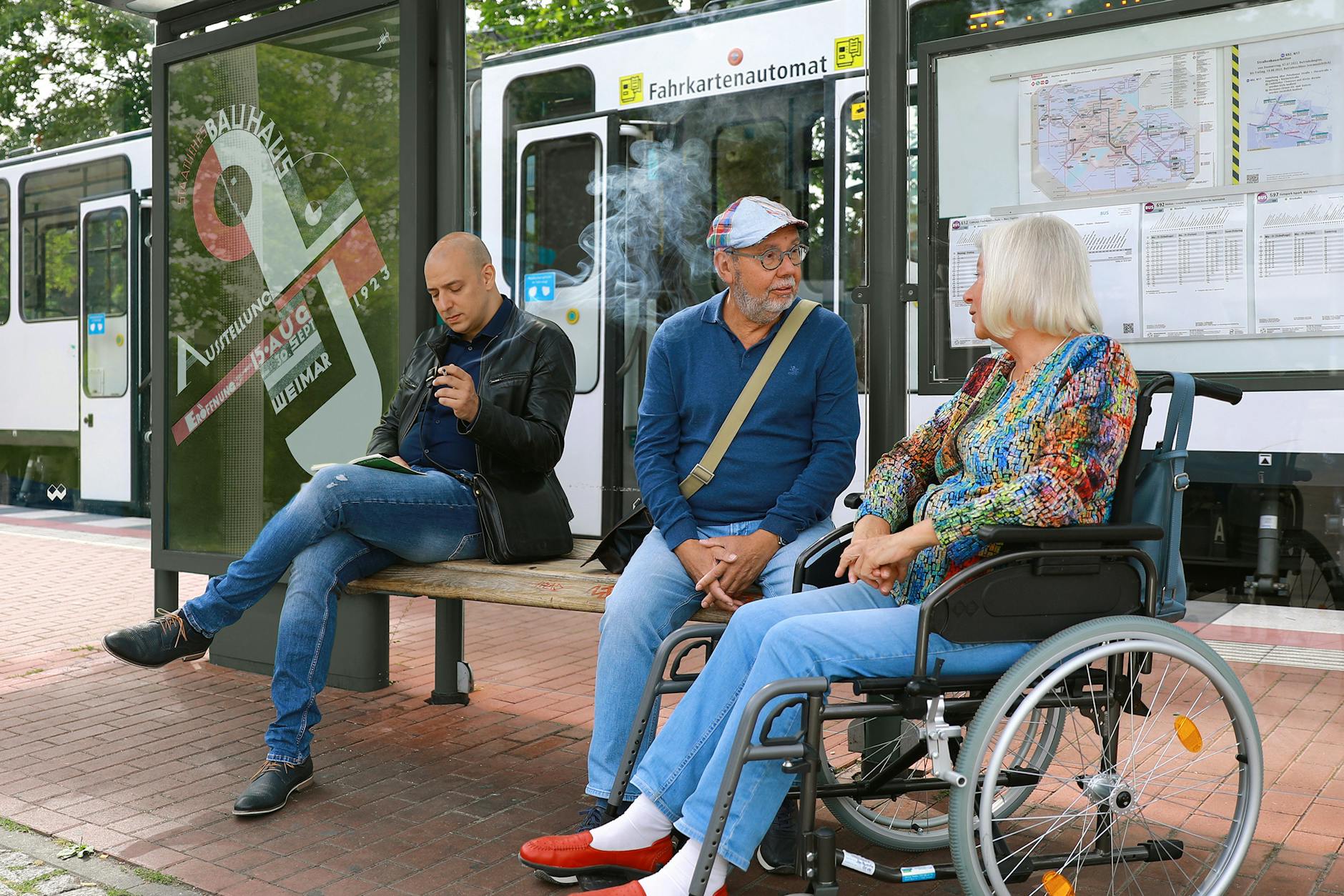 People waiting at a bus stop for Trondheim mobility weather planning.