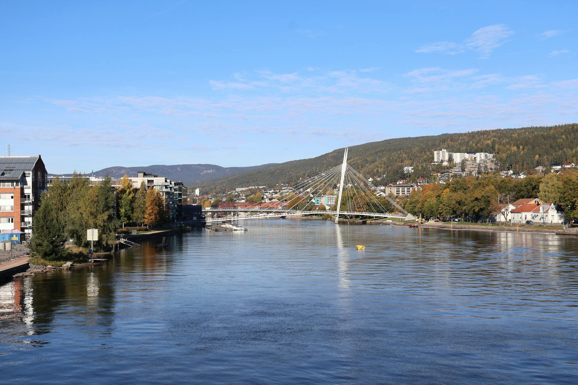 Norwegian riverside bridge for Trondheim NGO travel report planning.