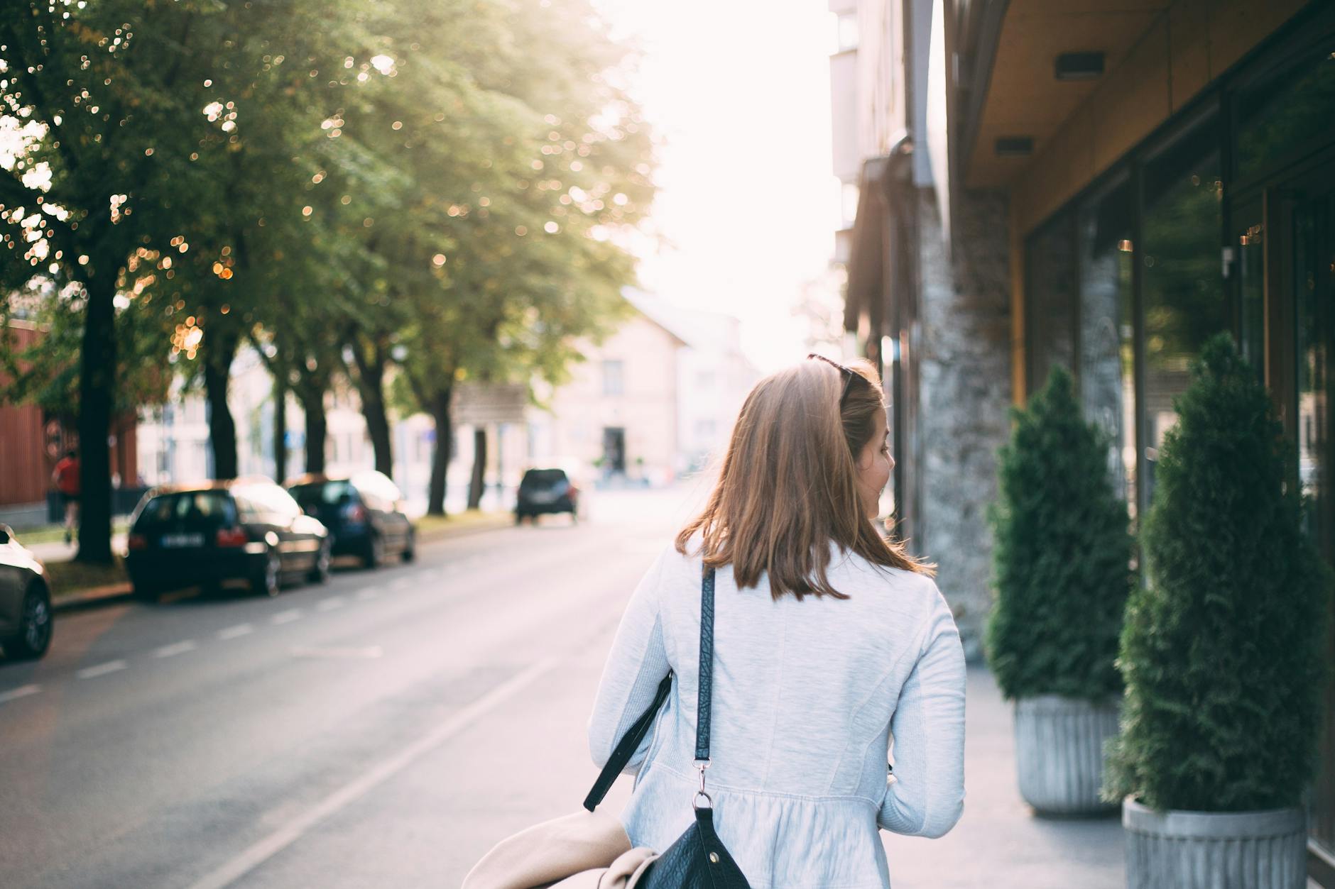 Woman walking outdoors for Trondheim arrival and first-route planning.