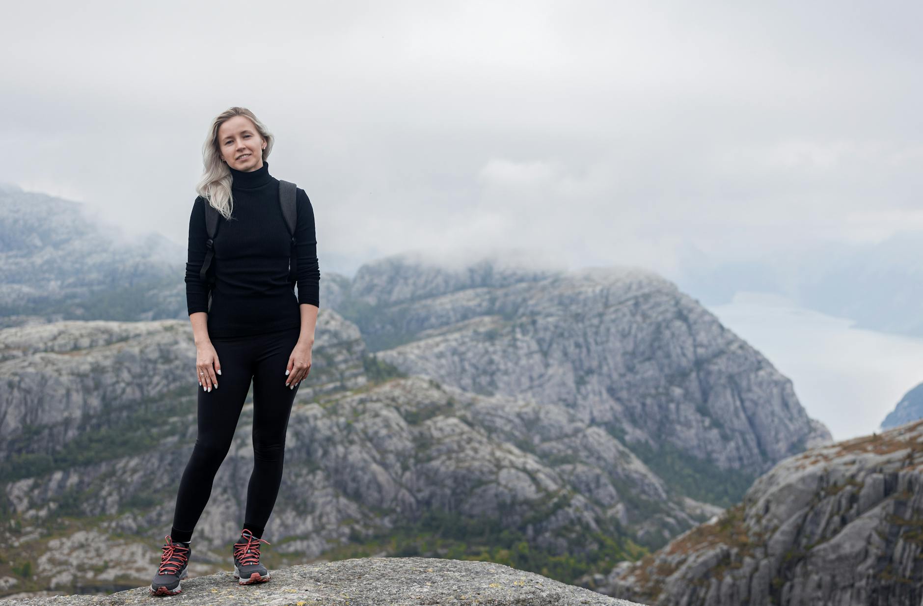 Woman in Norwegian mountains for Trondheim scenic outing planning.