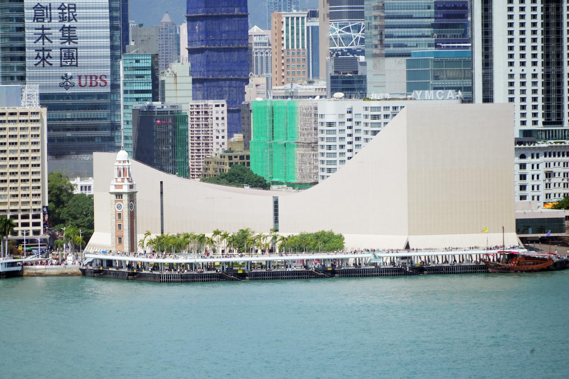 Victoria Harbour skyline and Tsim Sha Tsui conference weather planning context.
