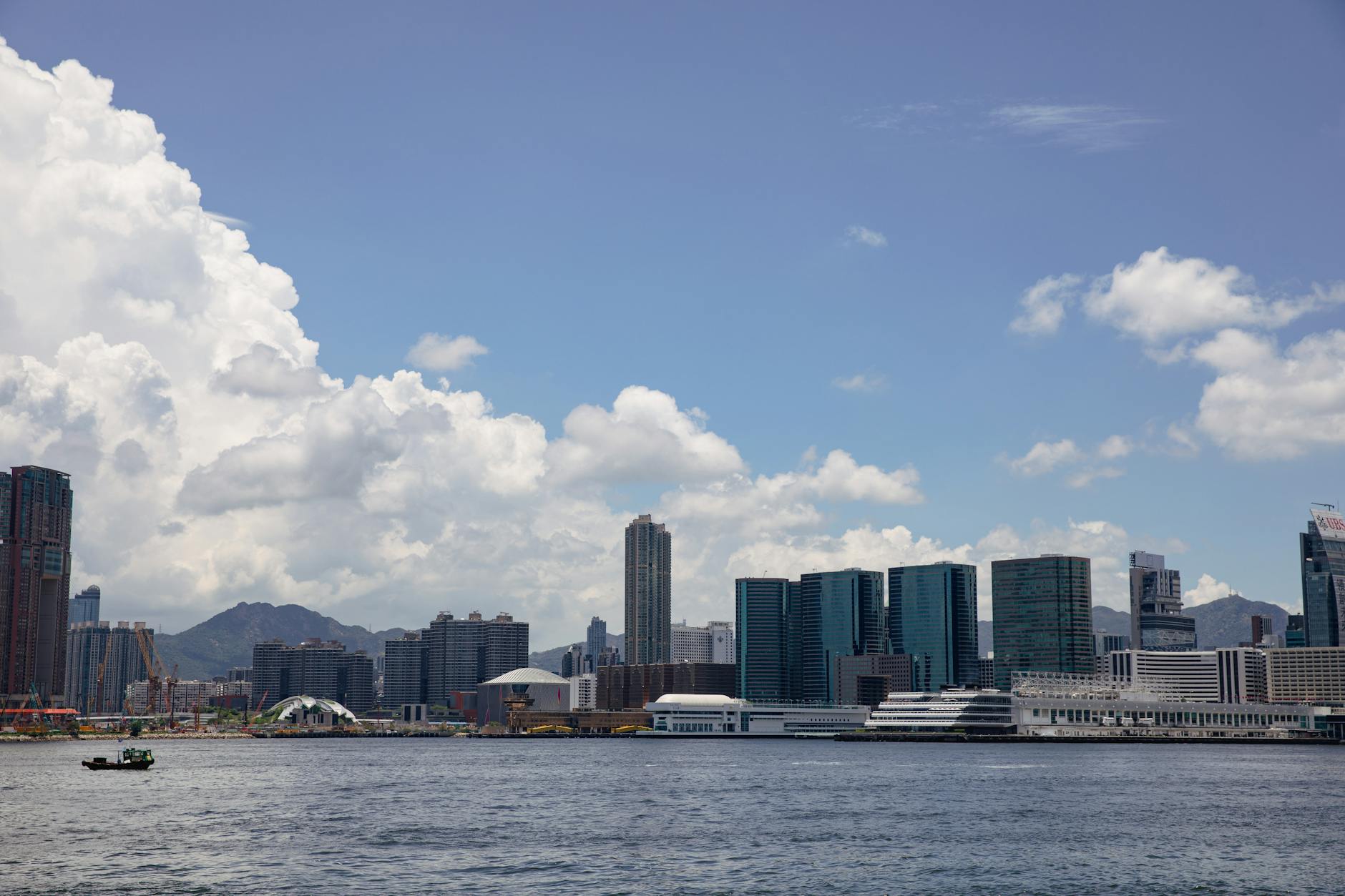 Tsim Sha Tsui harbor and outdoor traveler planning context.
