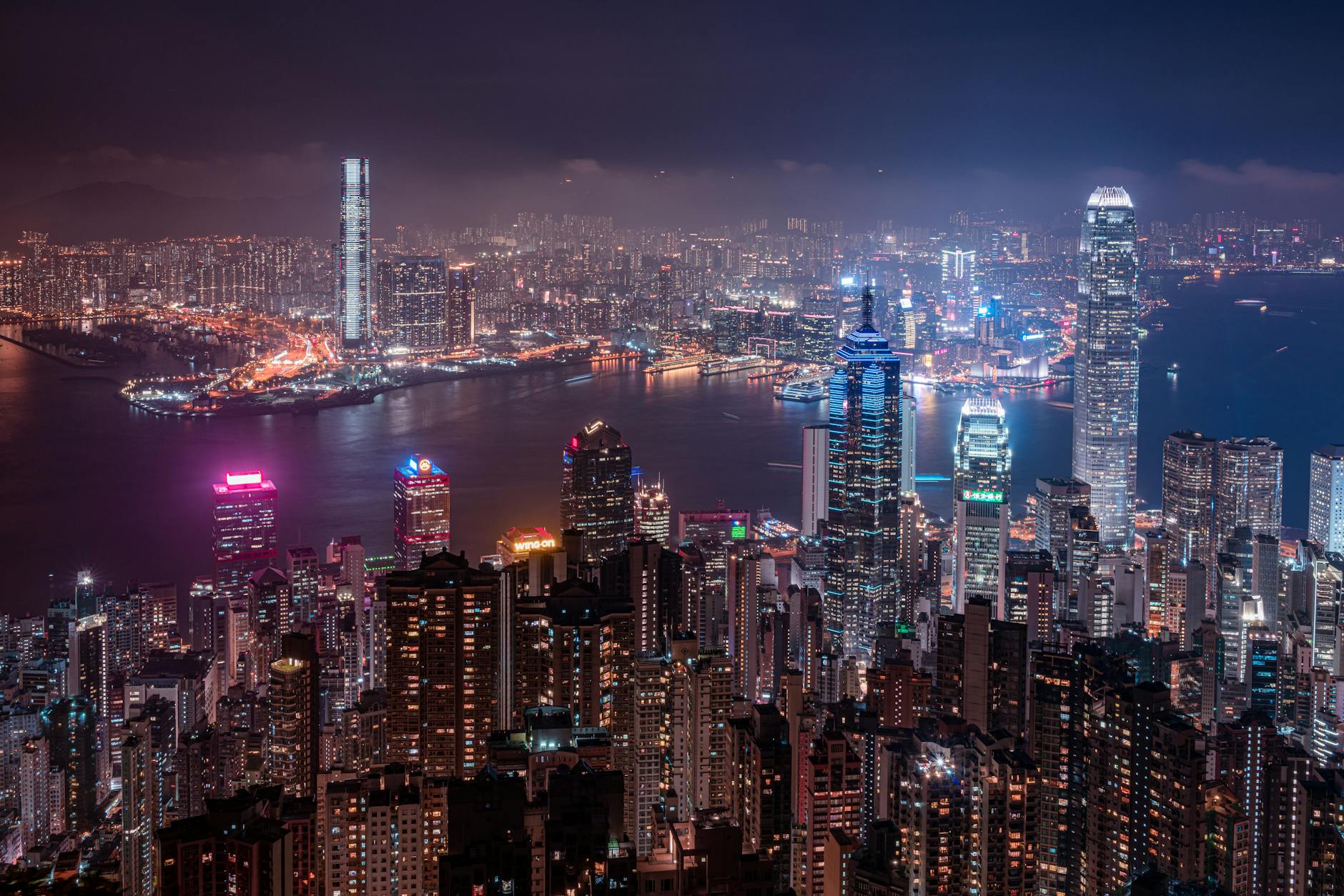 Tsim Sha Tsui night skyline and business visitor planning context.