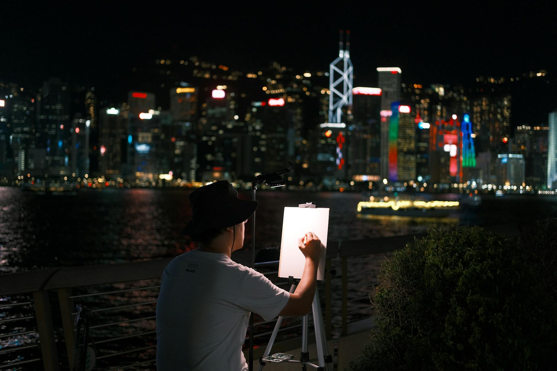 Tsim Sha Tsui night skyline and conference attendee planning context.