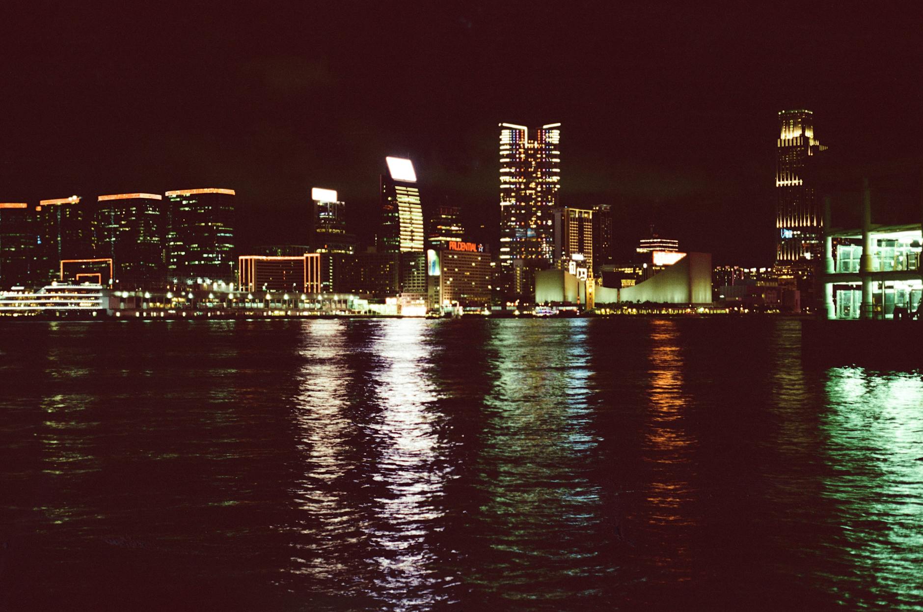 Tsim Sha Tsui night skyline and consultant planning context.