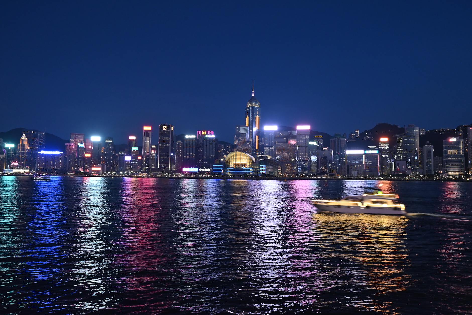 Tsim Sha Tsui night skyline and family traveler planning context.