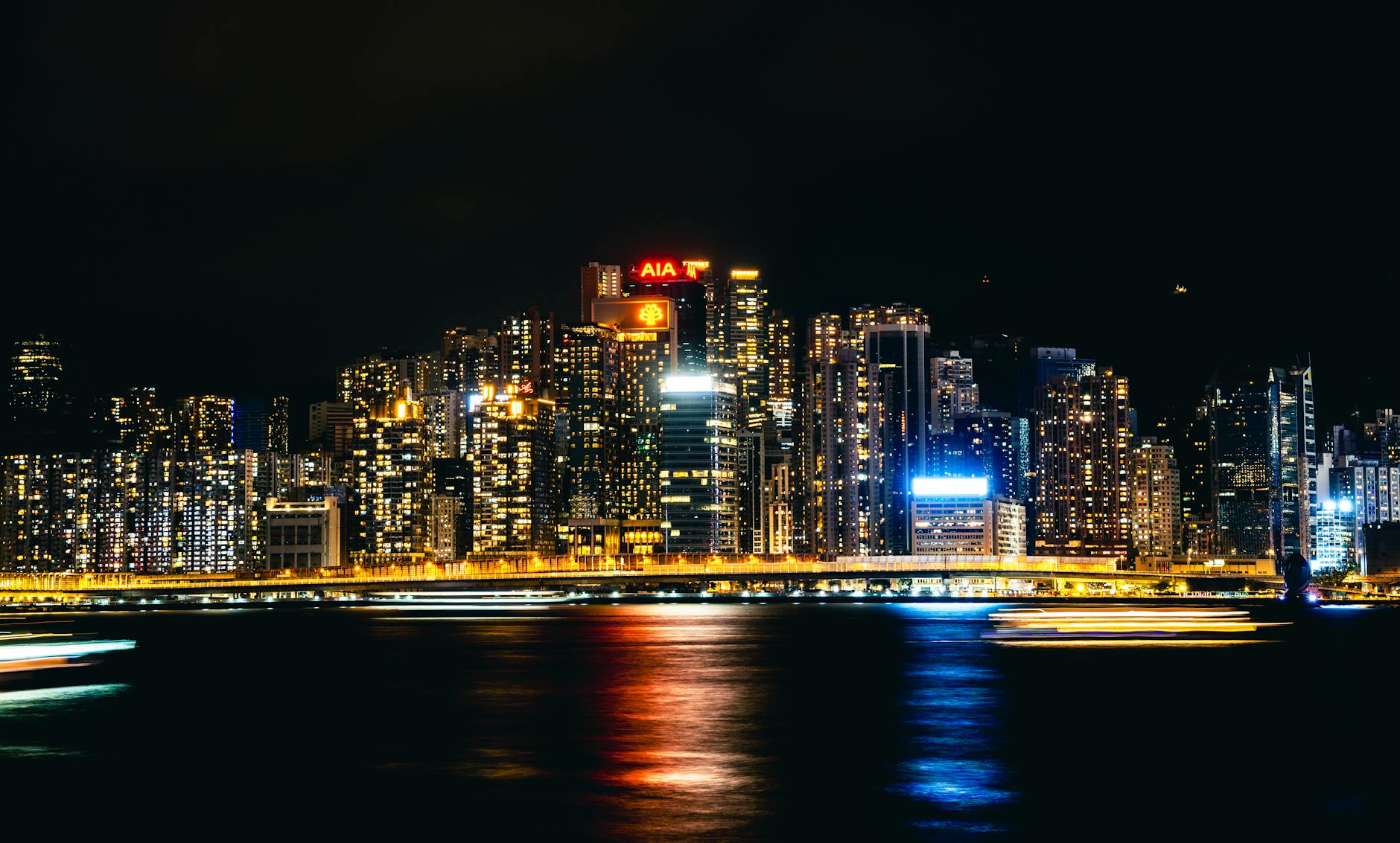Tsim Sha Tsui night skyline and investor deal-team planning context.