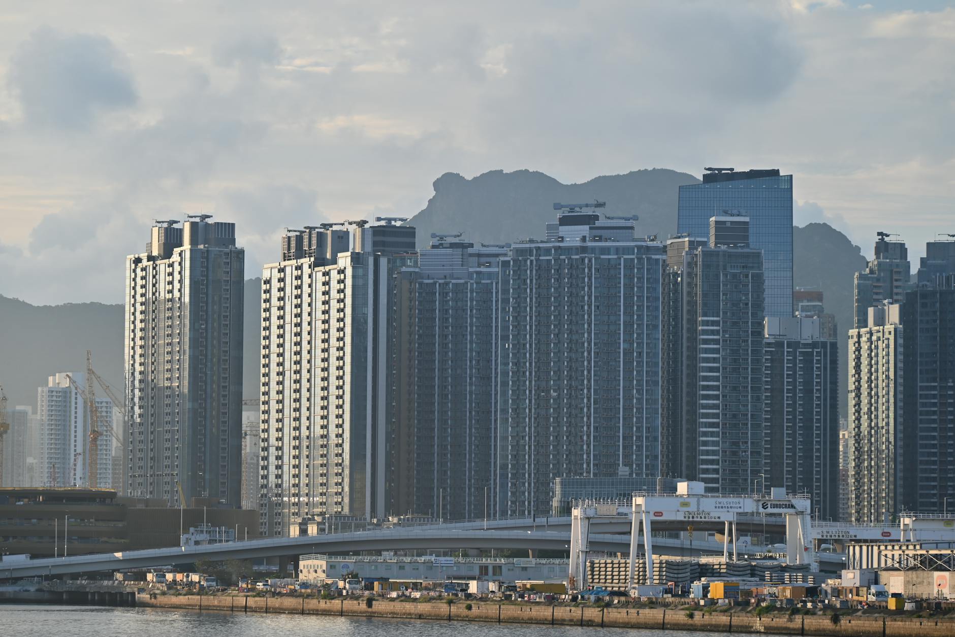 Tsim Sha Tsui journalist and skyline planning context.