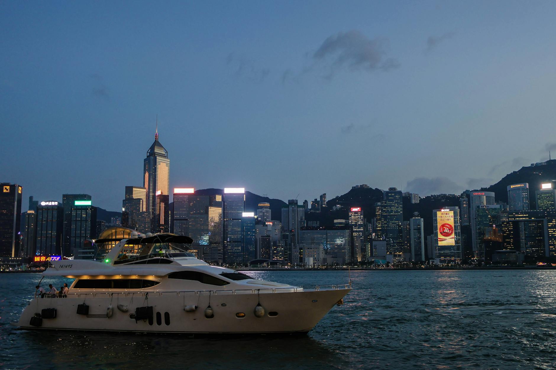 Tsim Sha Tsui night skyline and luxury traveler planning context.