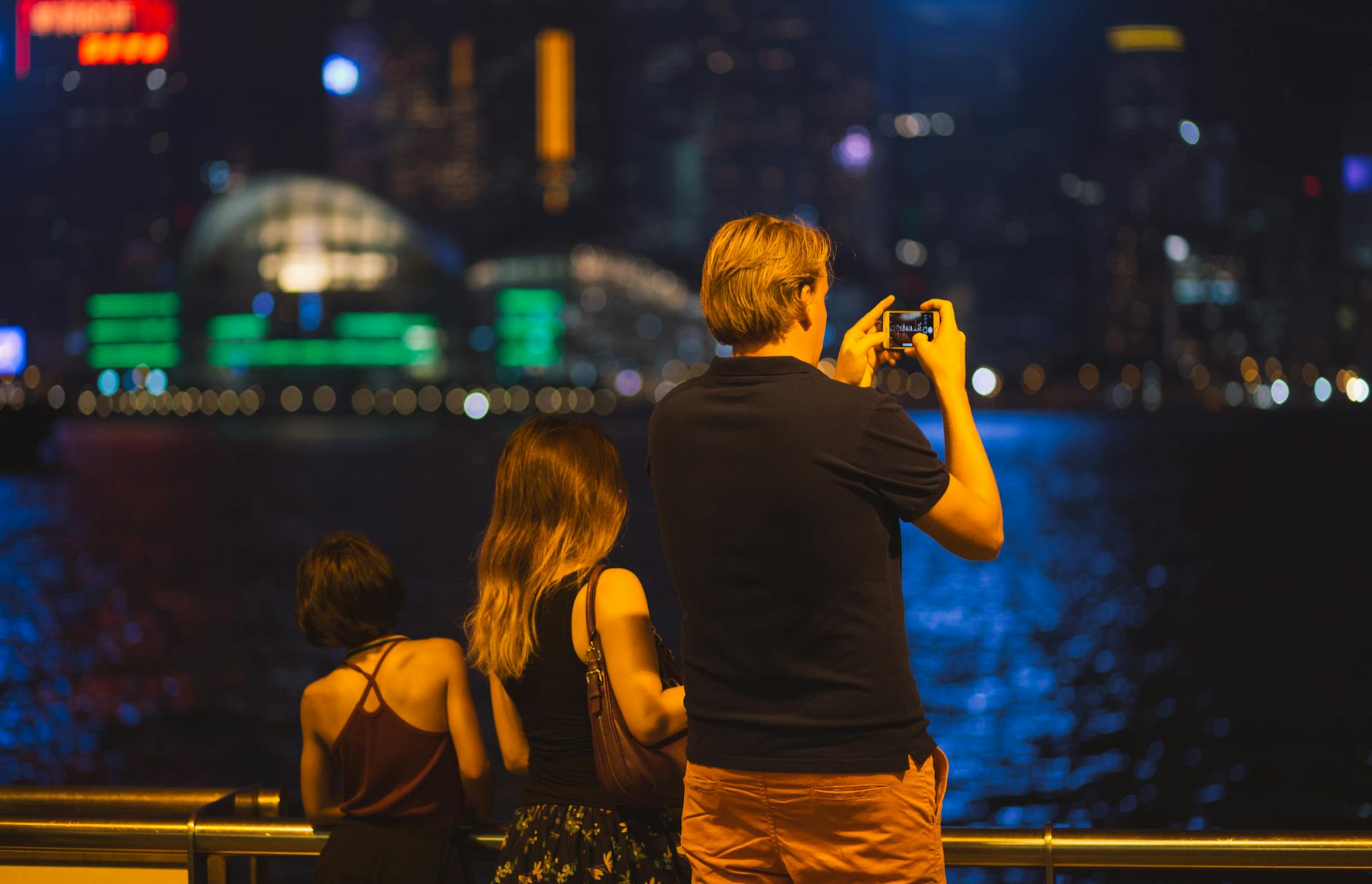 Tsim Sha Tsui night skyline and repeat leisure visitor planning context.