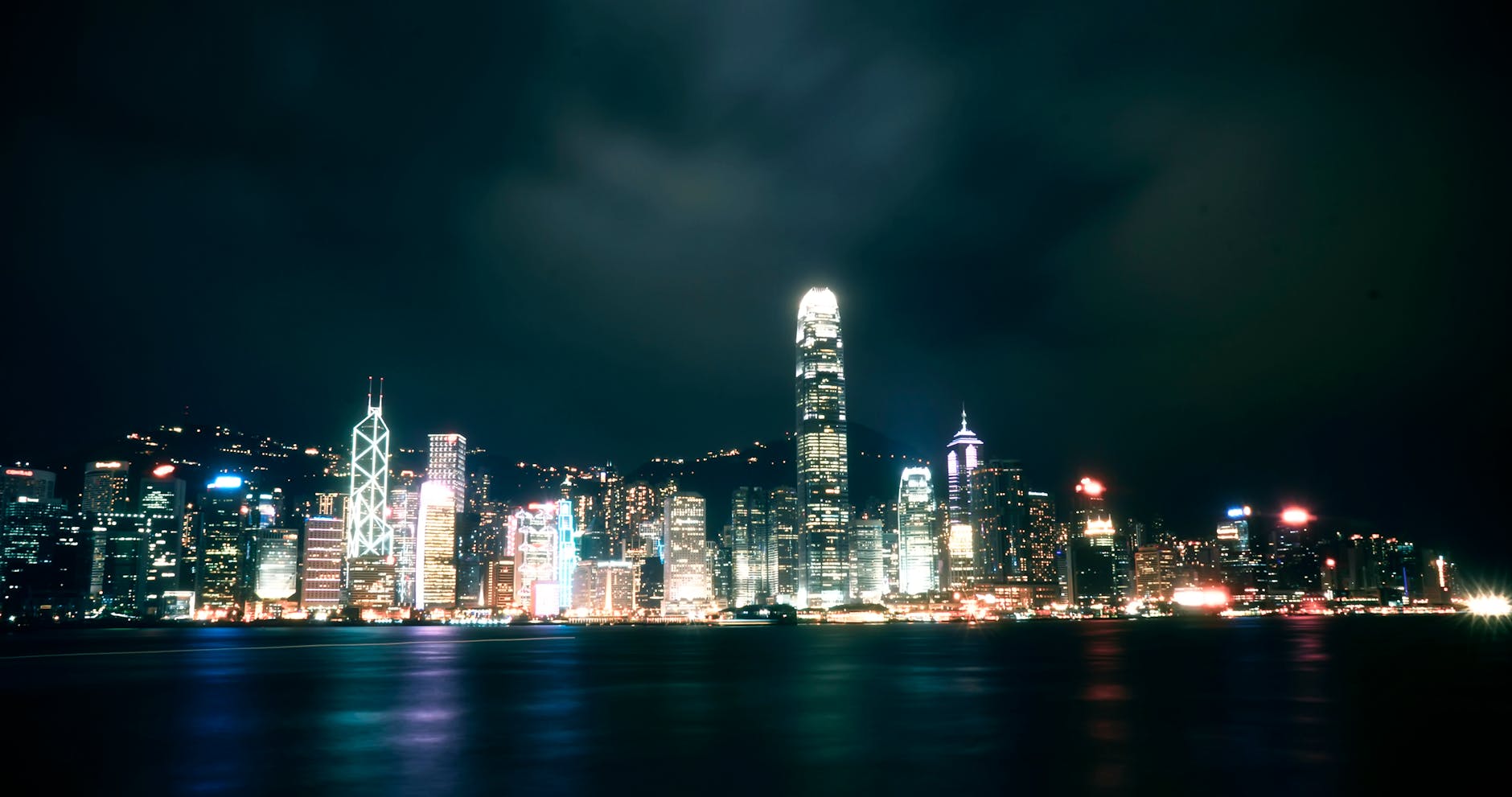 Tsim Sha Tsui night skyline and trade-show attendee planning context.