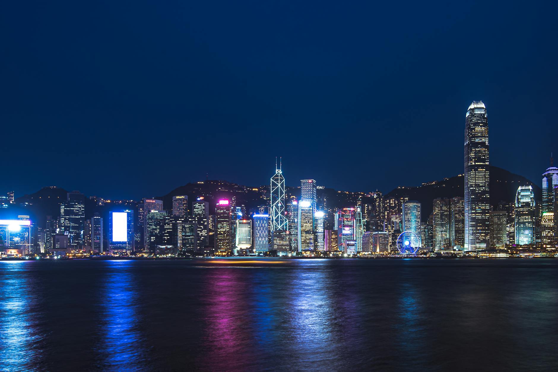 Tsim Sha Tsui night skyline and medical-constraints traveler planning context.