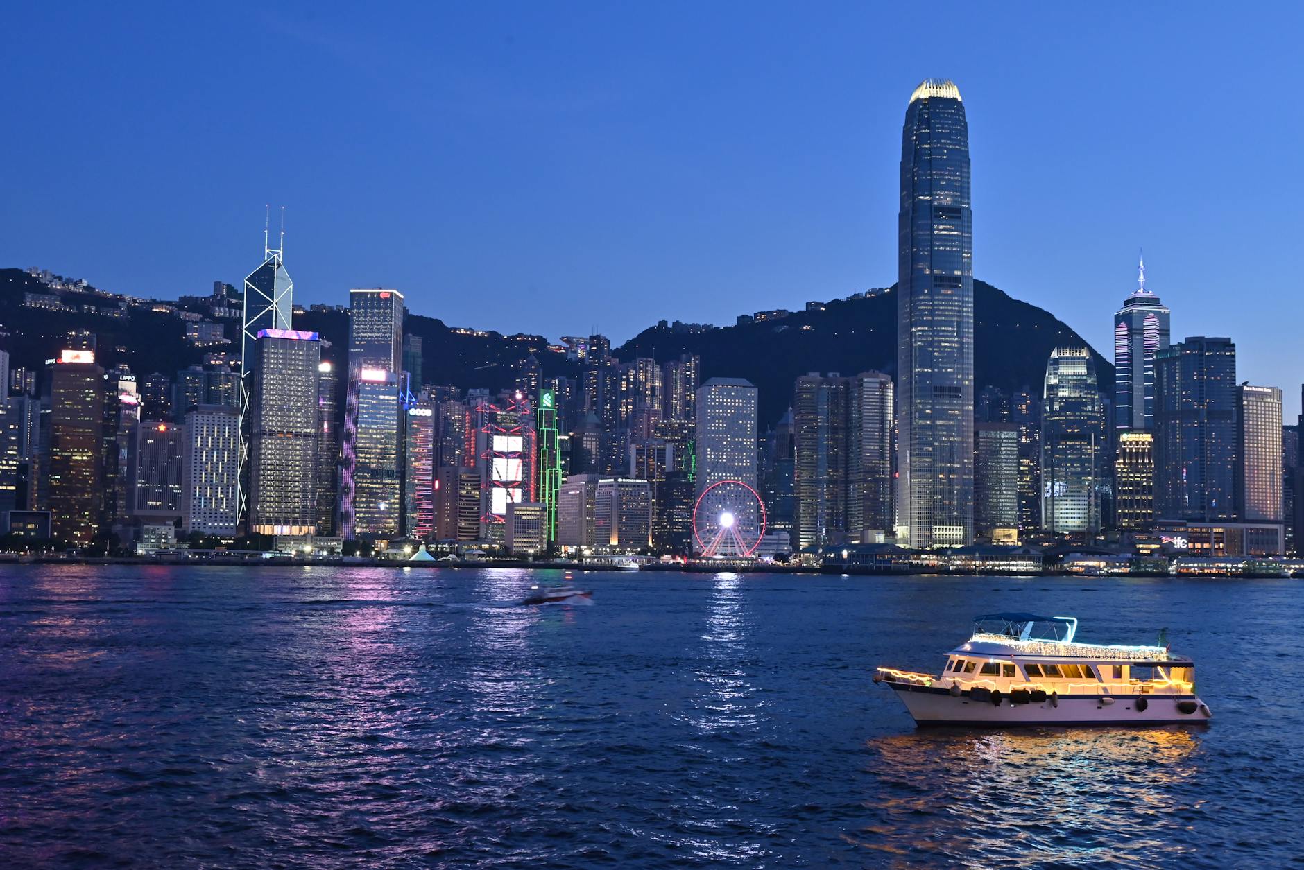 Tsim Sha Tsui night skyline and mobility-limited traveler planning context.