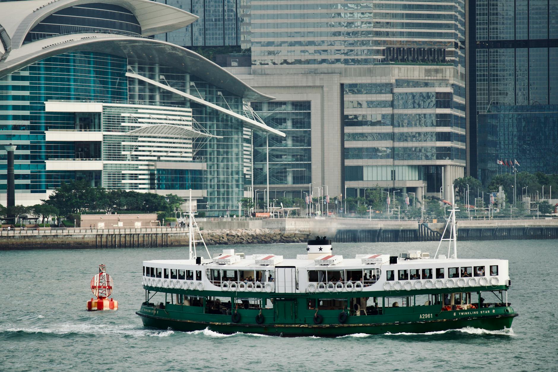 Star Ferry and woman traveler cross-harbor planning context.