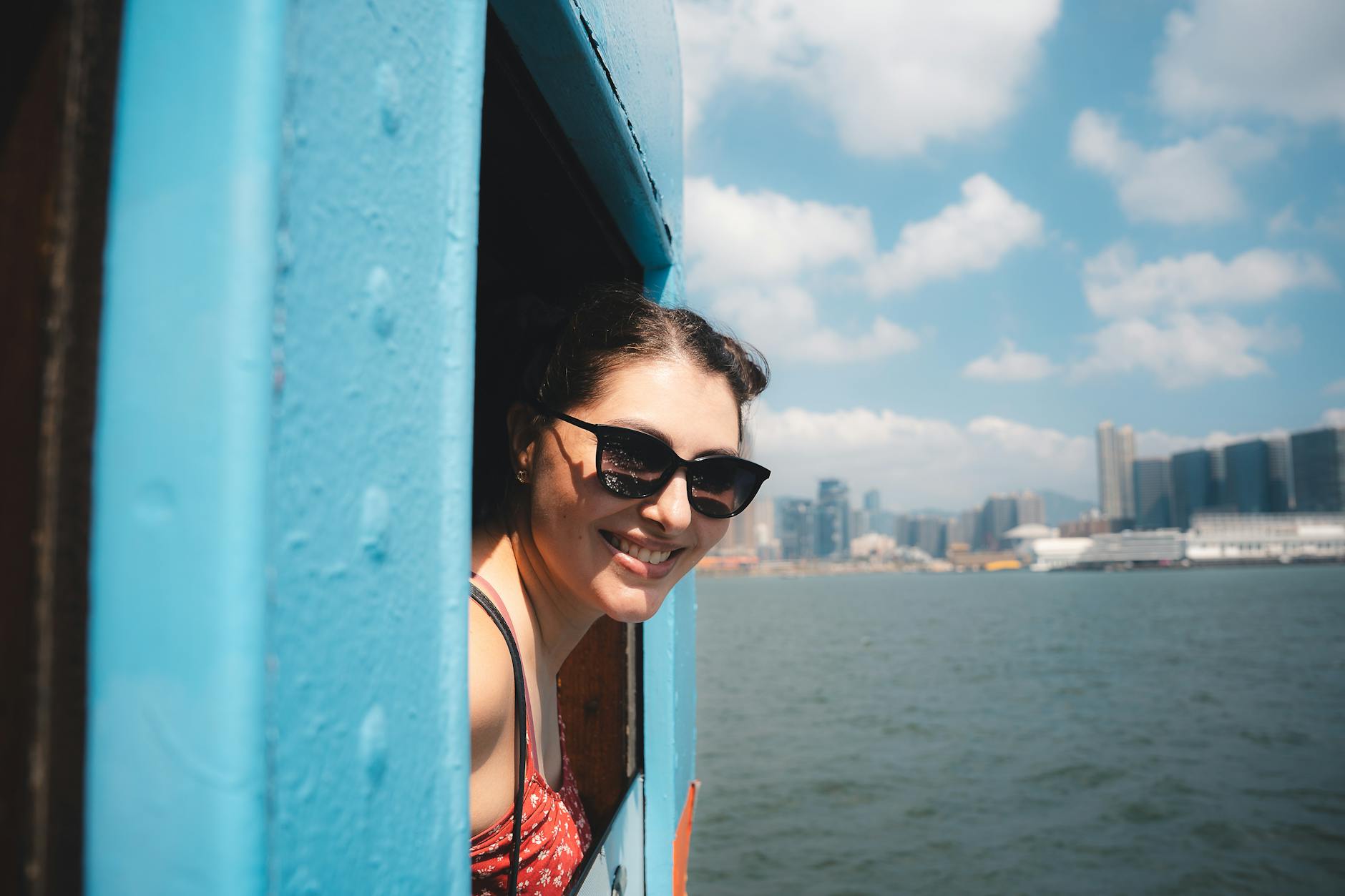 Tsim Sha Tsui woman traveler and skyline planning context.