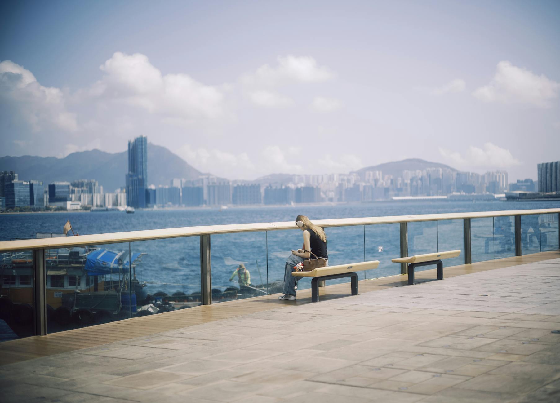 Tsim Sha Tsui promenade and woman traveler arrival planning context.