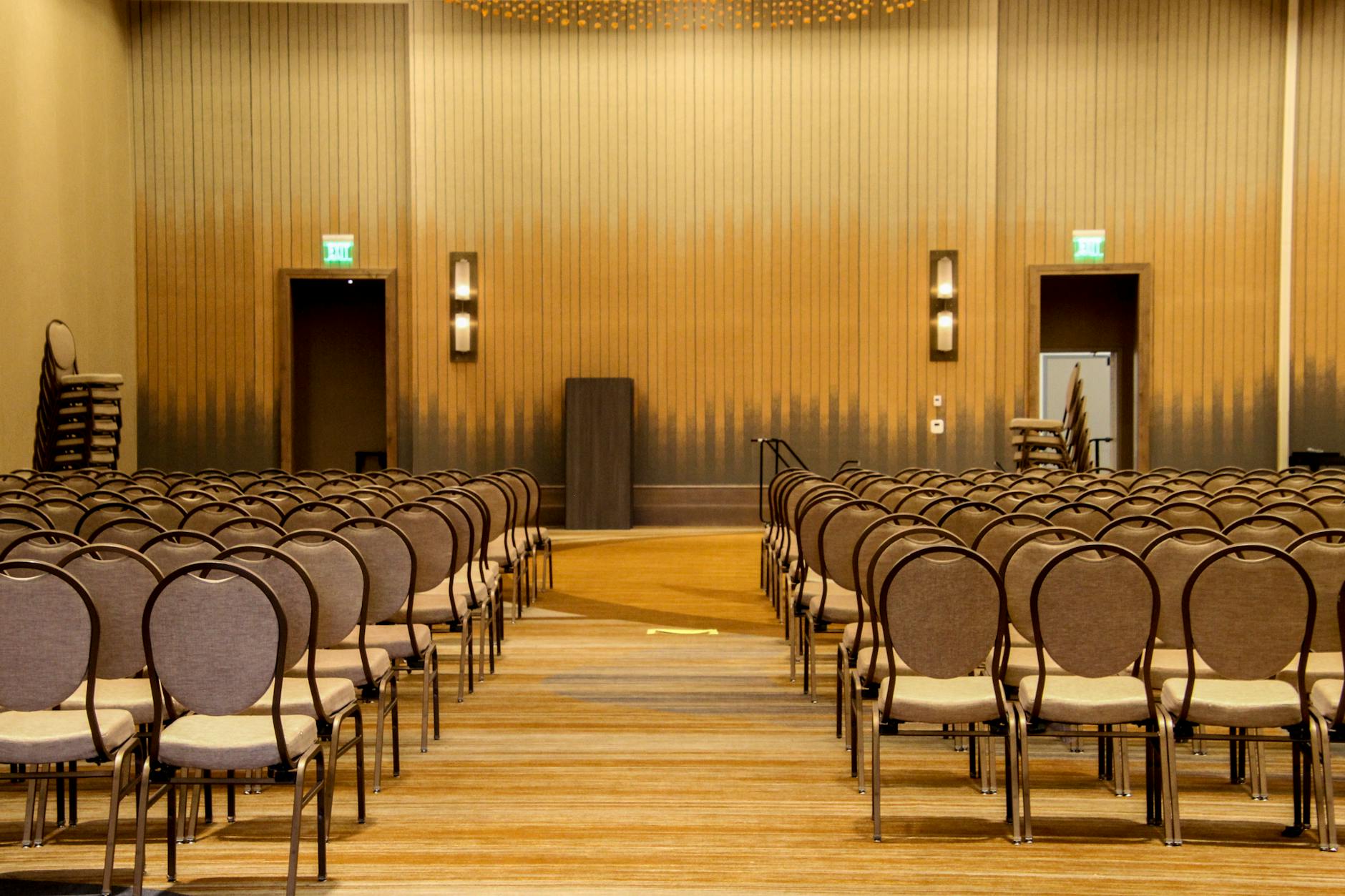 Empty conference room arranged with rows of chairs