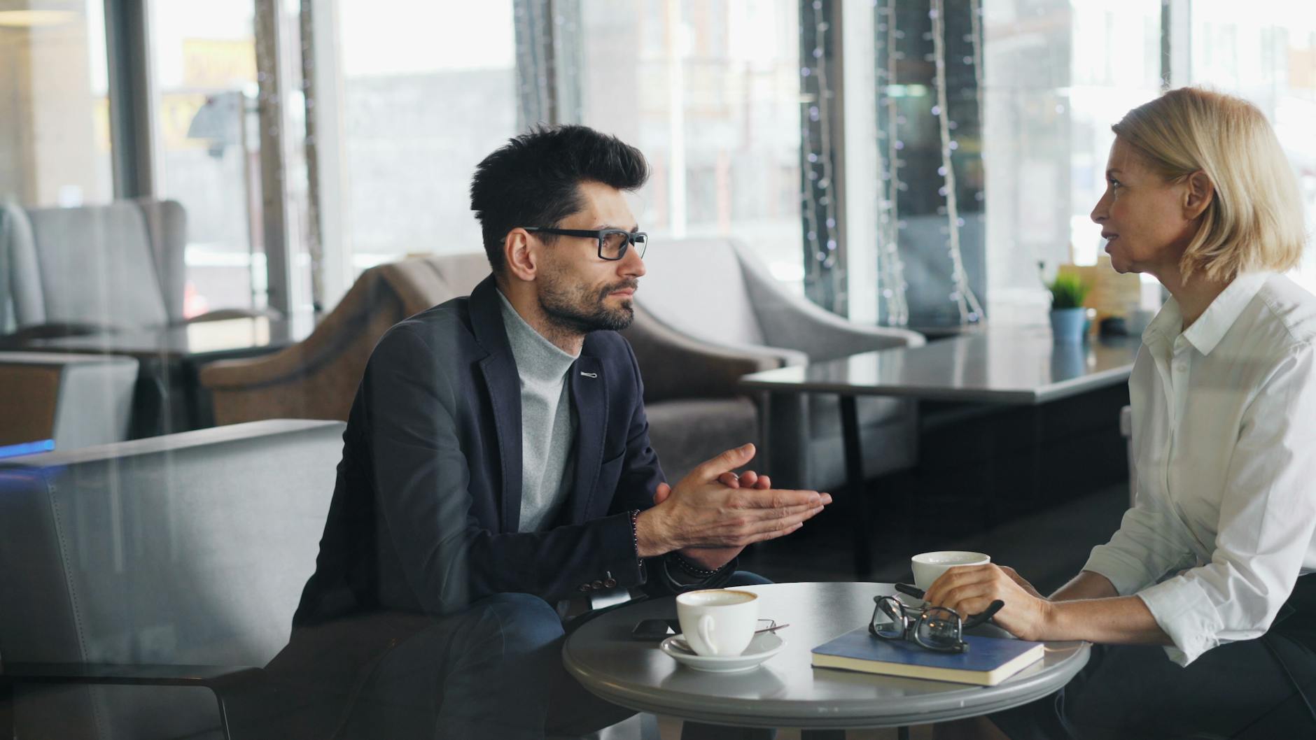 Business discussion over coffee in a contemporary cafe