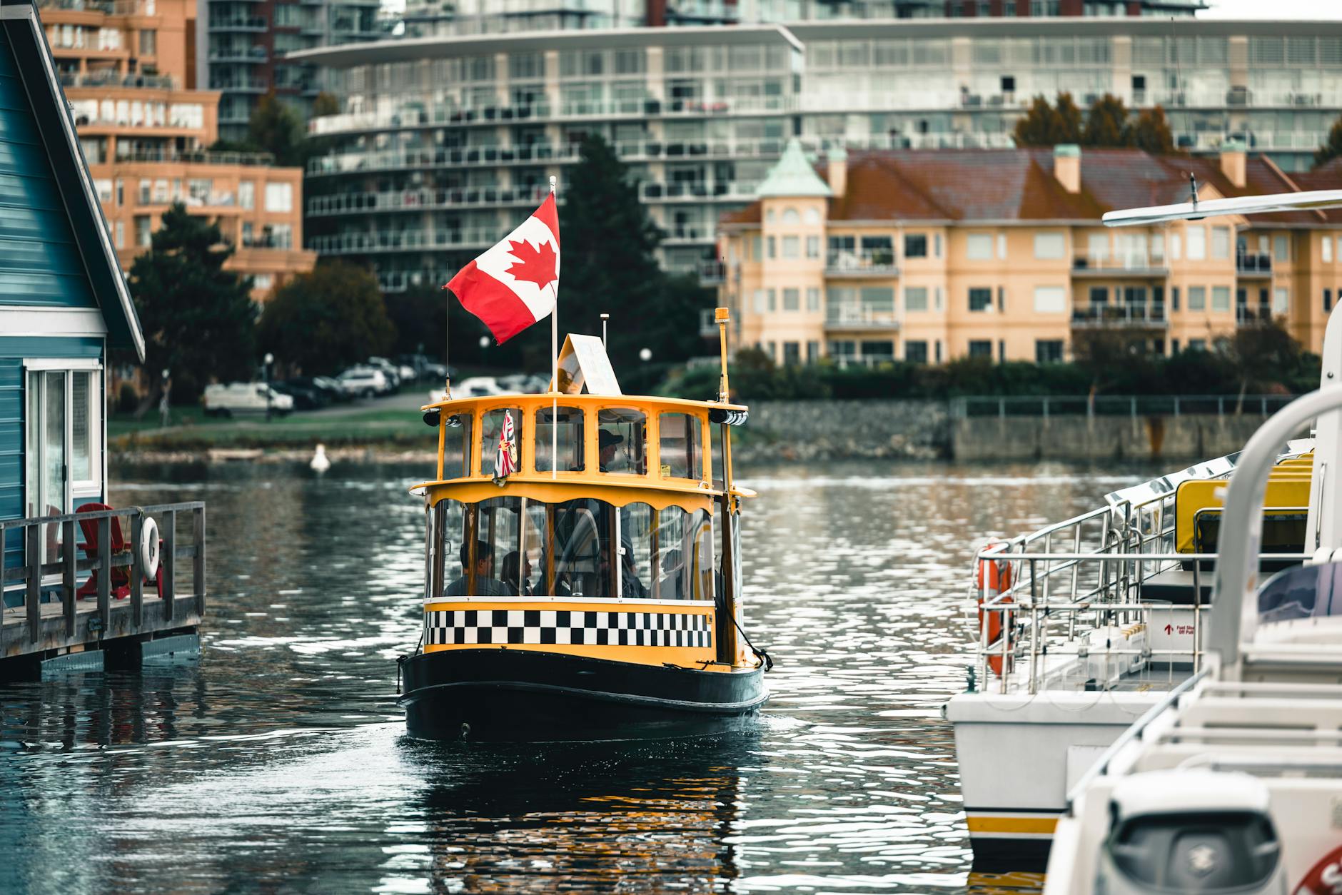 Yellow ferry navigating Victoria Harbour