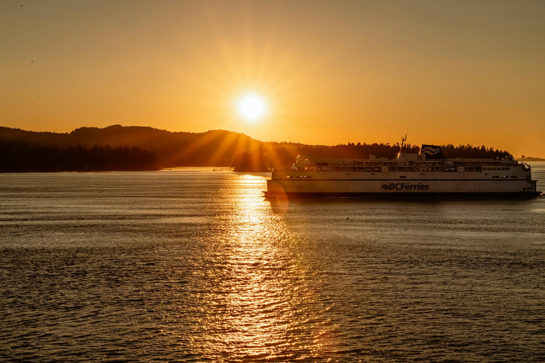 BC Ferries ship sailing during a golden sunset