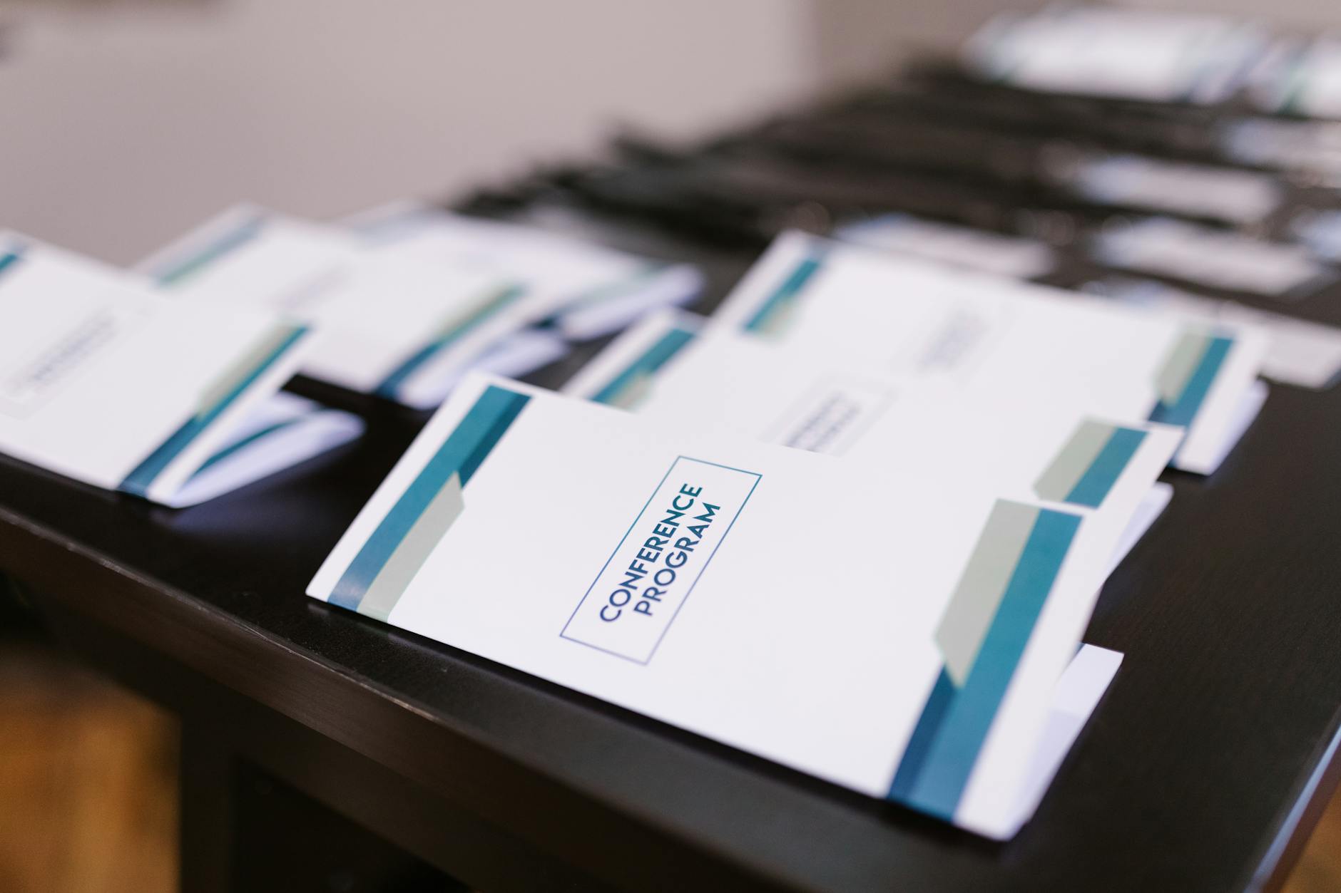 Conference program booklets arranged on a table