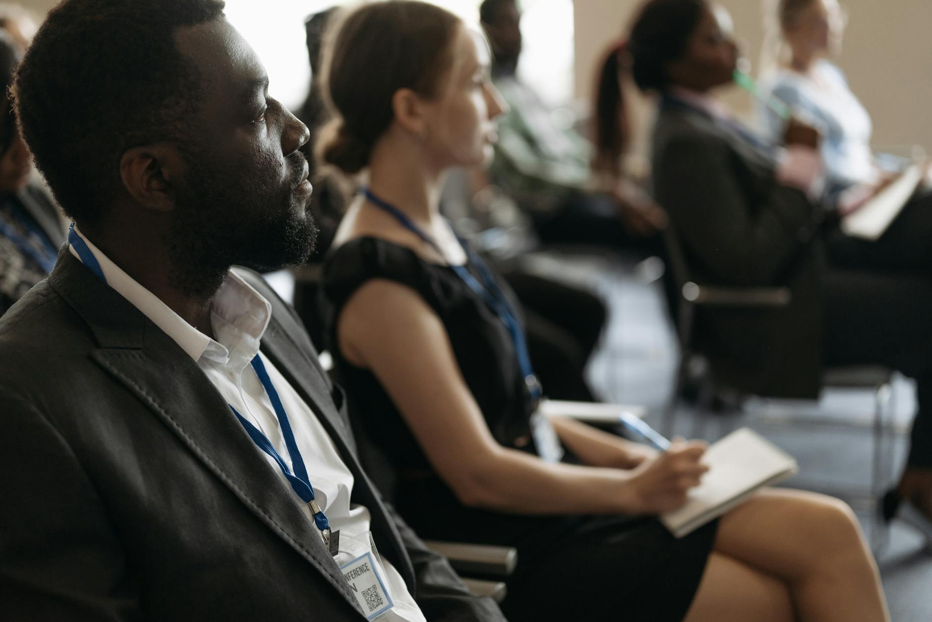 Professionals listening during a conference seminar