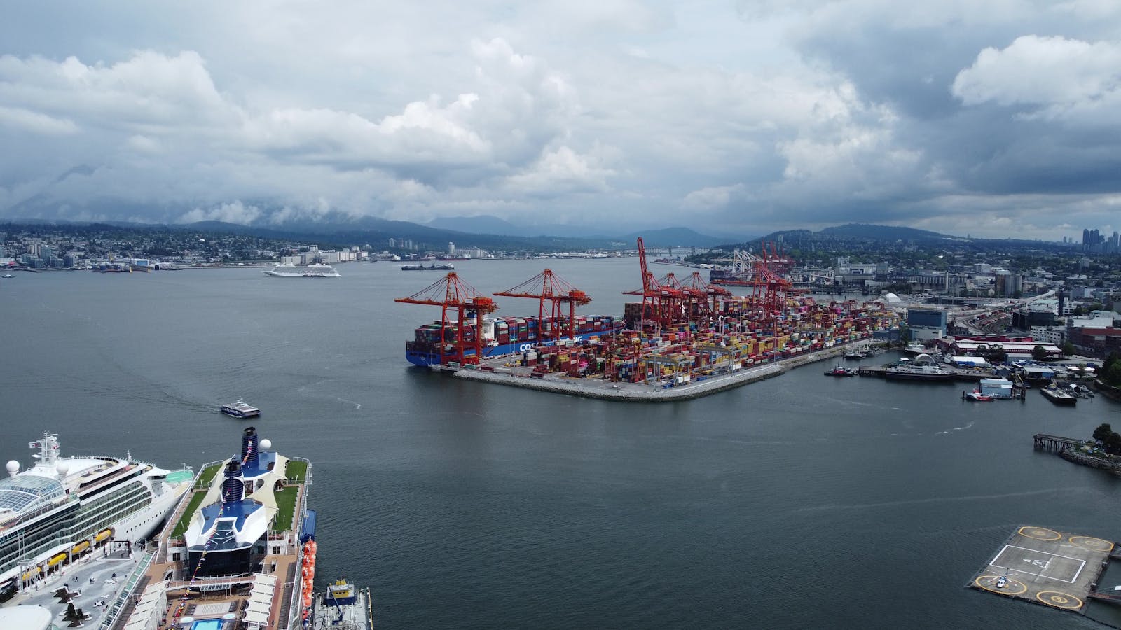 Aerial view of the bustling container port in Vancouver with cruise ships.