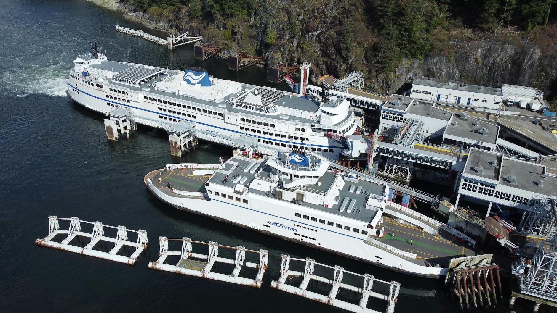 Large BC Ferries docked at a scenic coastal terminal