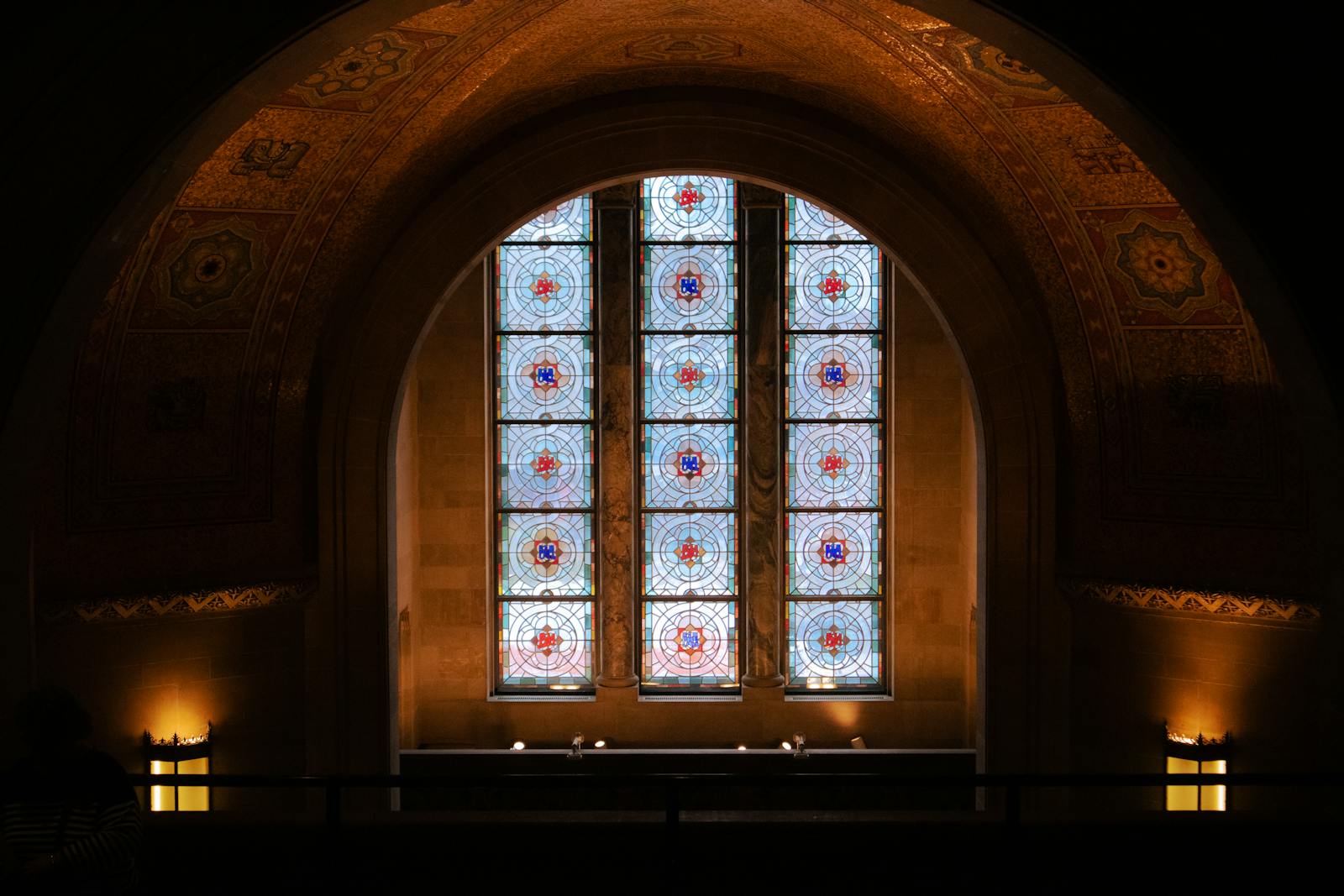 Elegant stained glass window in a Toronto cathedral, showcasing religious art.