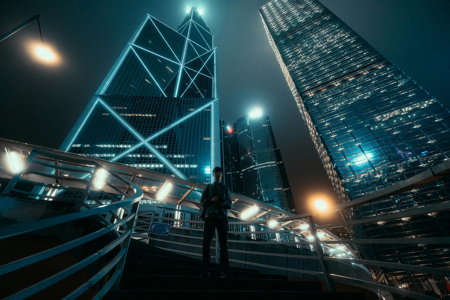 Wan Chai night skyline and academic conference report planning context.