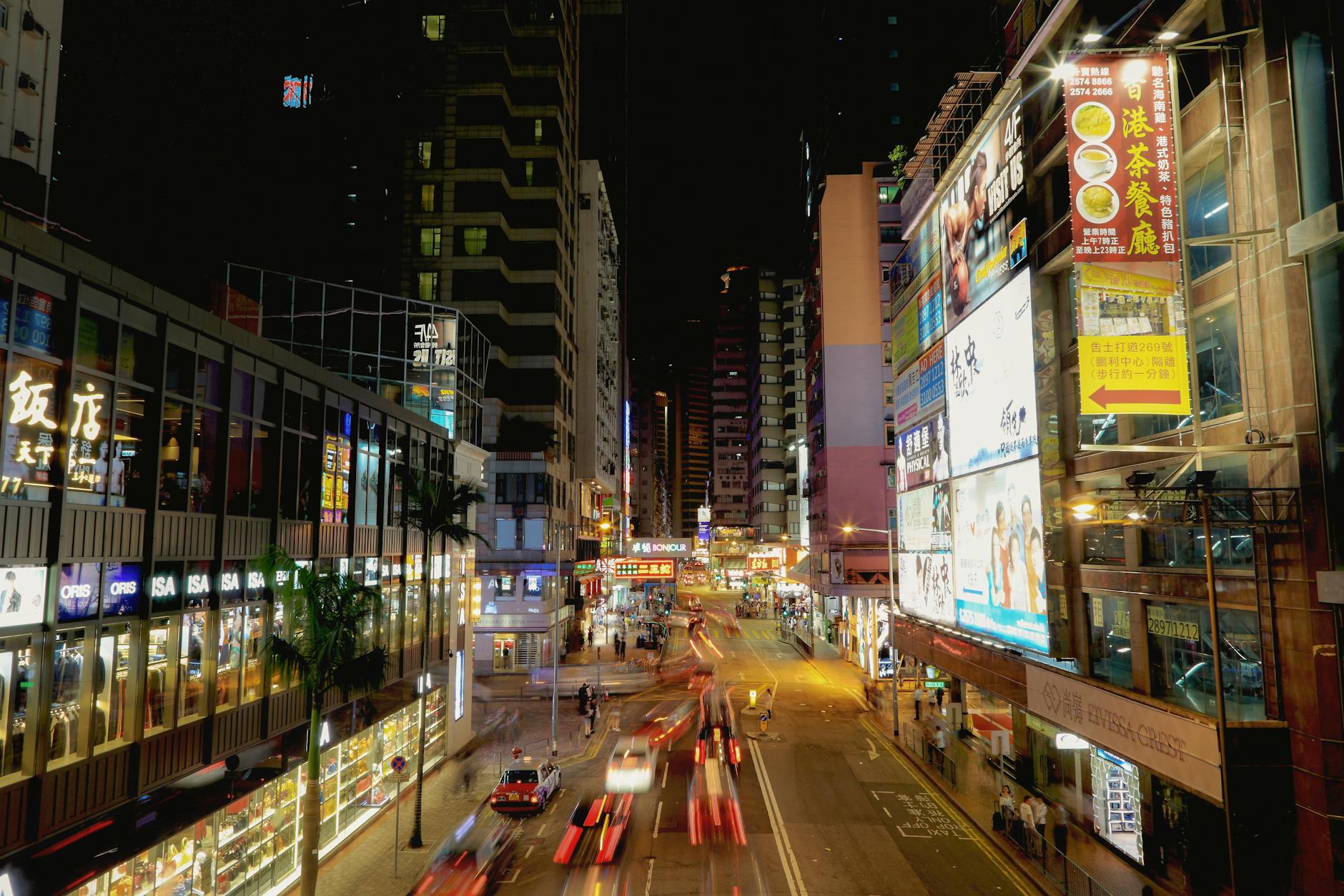 Wan Chai night skyline and business visitor report planning context.
