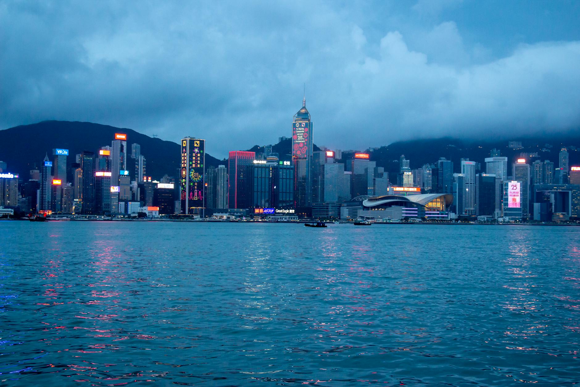 Wan Chai convention skyline and conference attendee report planning context.