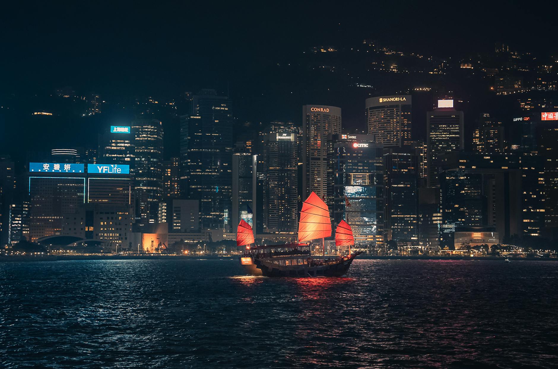 Wan Chai night harbor scene and creator evening coverage planning context.