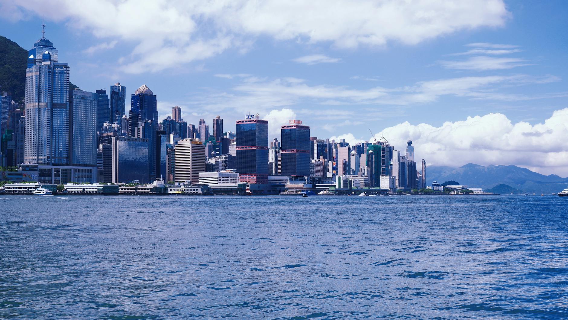 Hong Kong night skyline and cruise port-call report planning context.