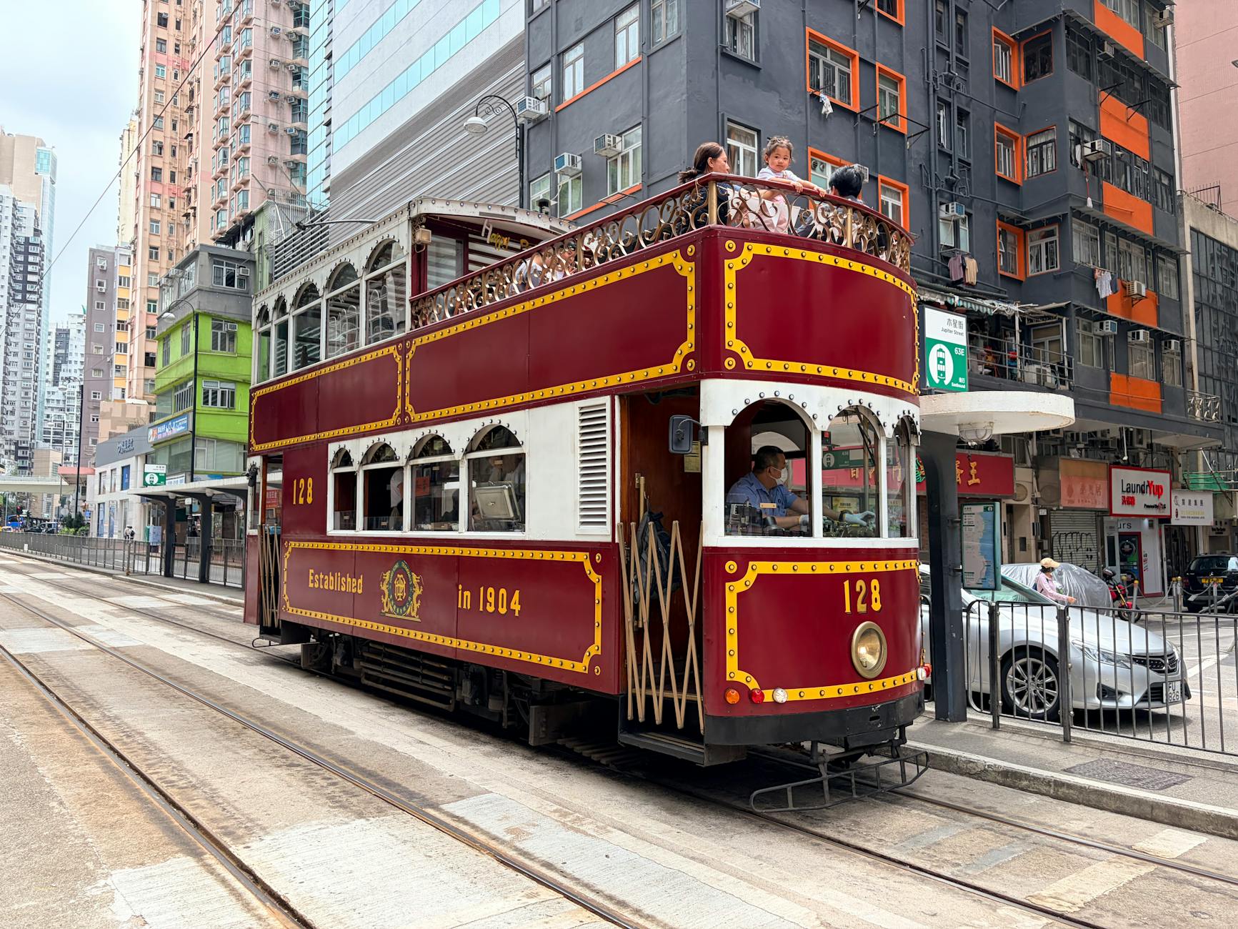Wan Chai tram and family arrival planning context.