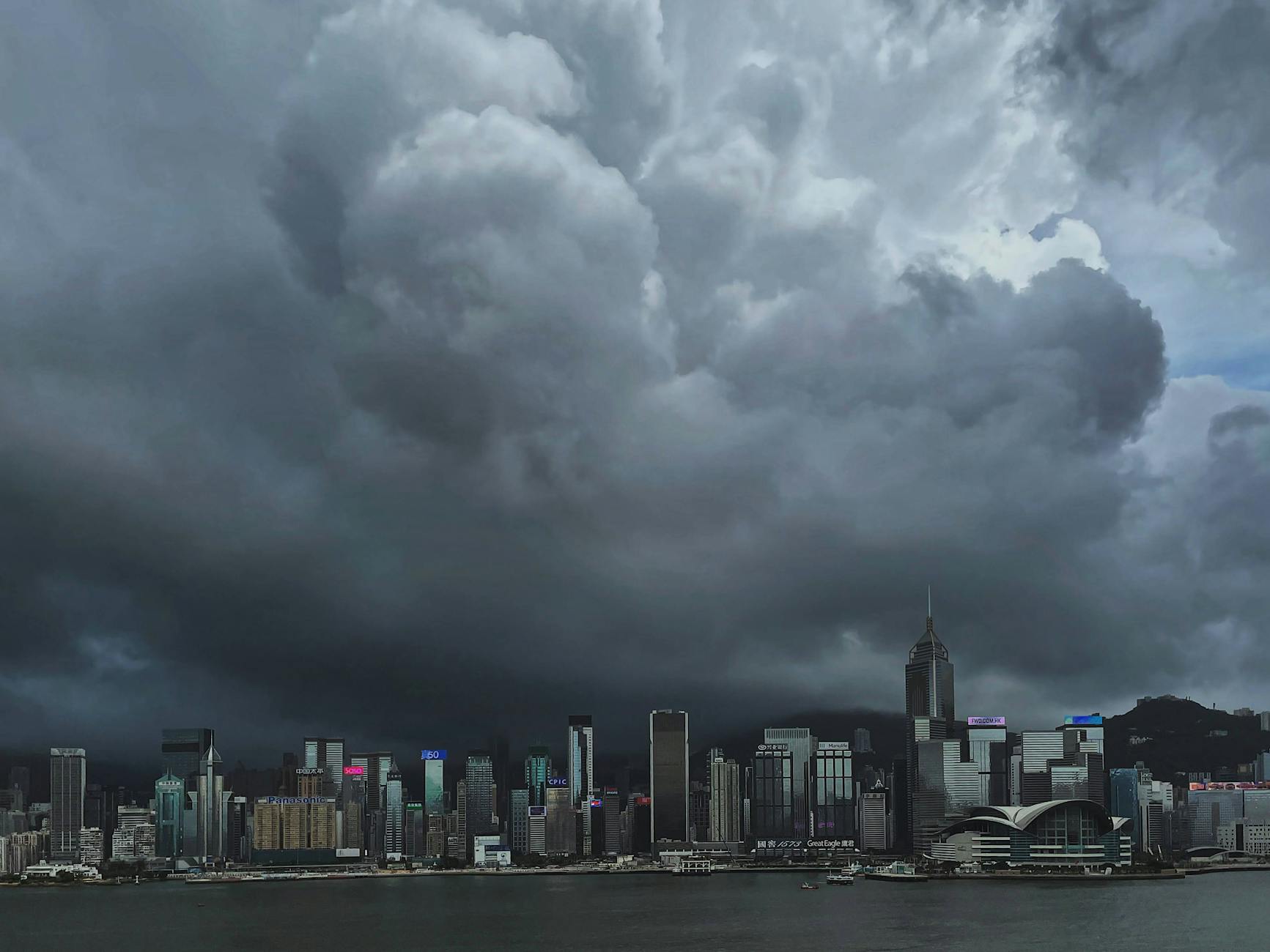 Wan Chai financial district rain and deal contingency planning context.