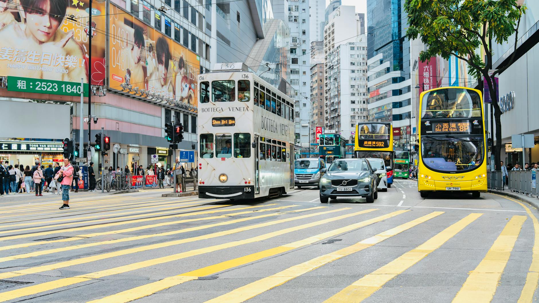 Wan Chai street crossing and journalist interview movement planning context.