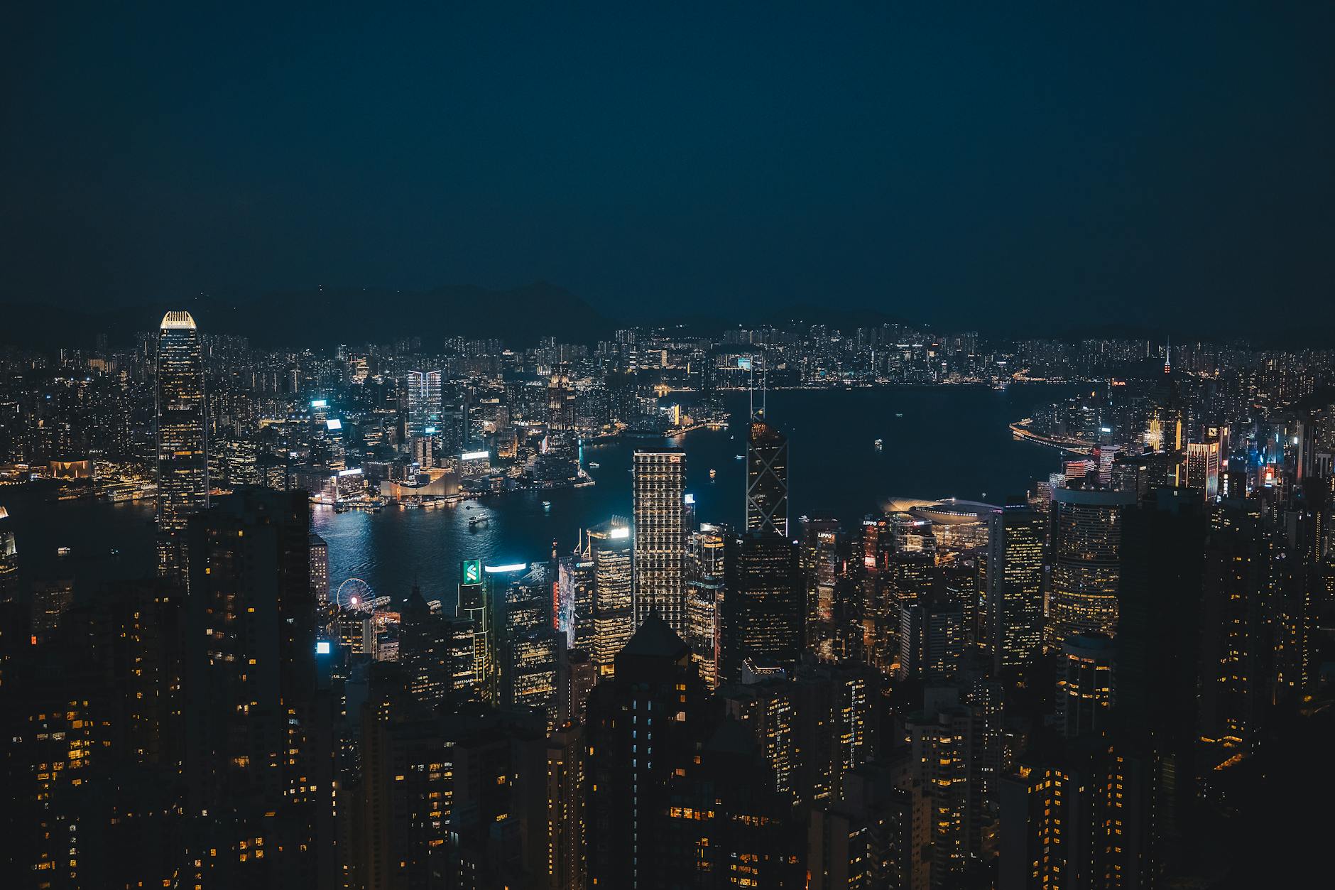 Wan Chai night skyline and journalist report planning context.