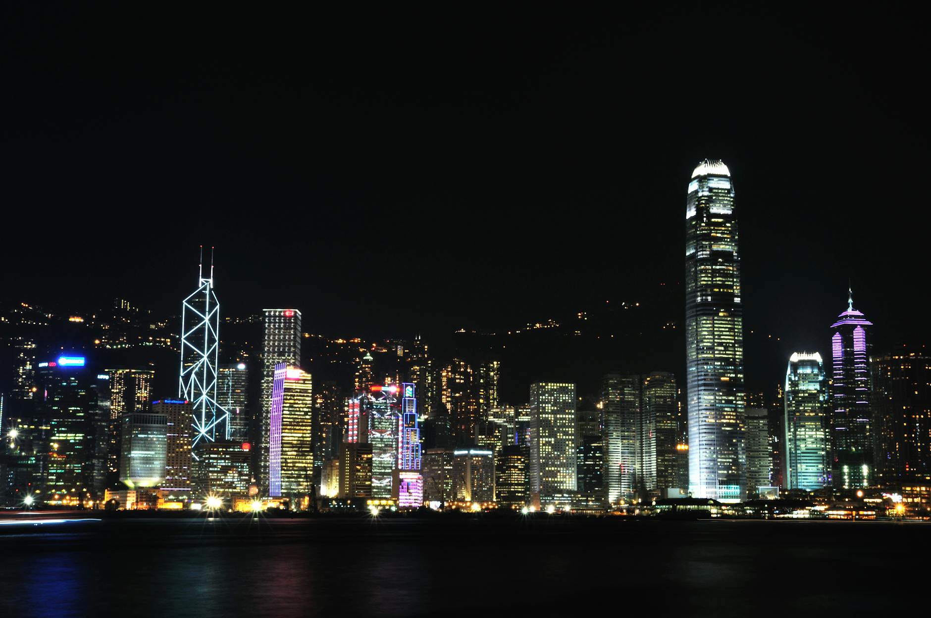 Wan Chai night skyline and luxury traveler report planning context.