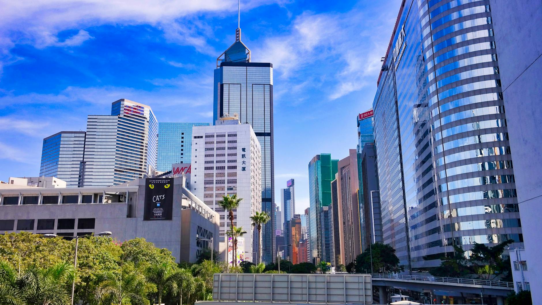 Wan Chai older traveler and skyline planning context.