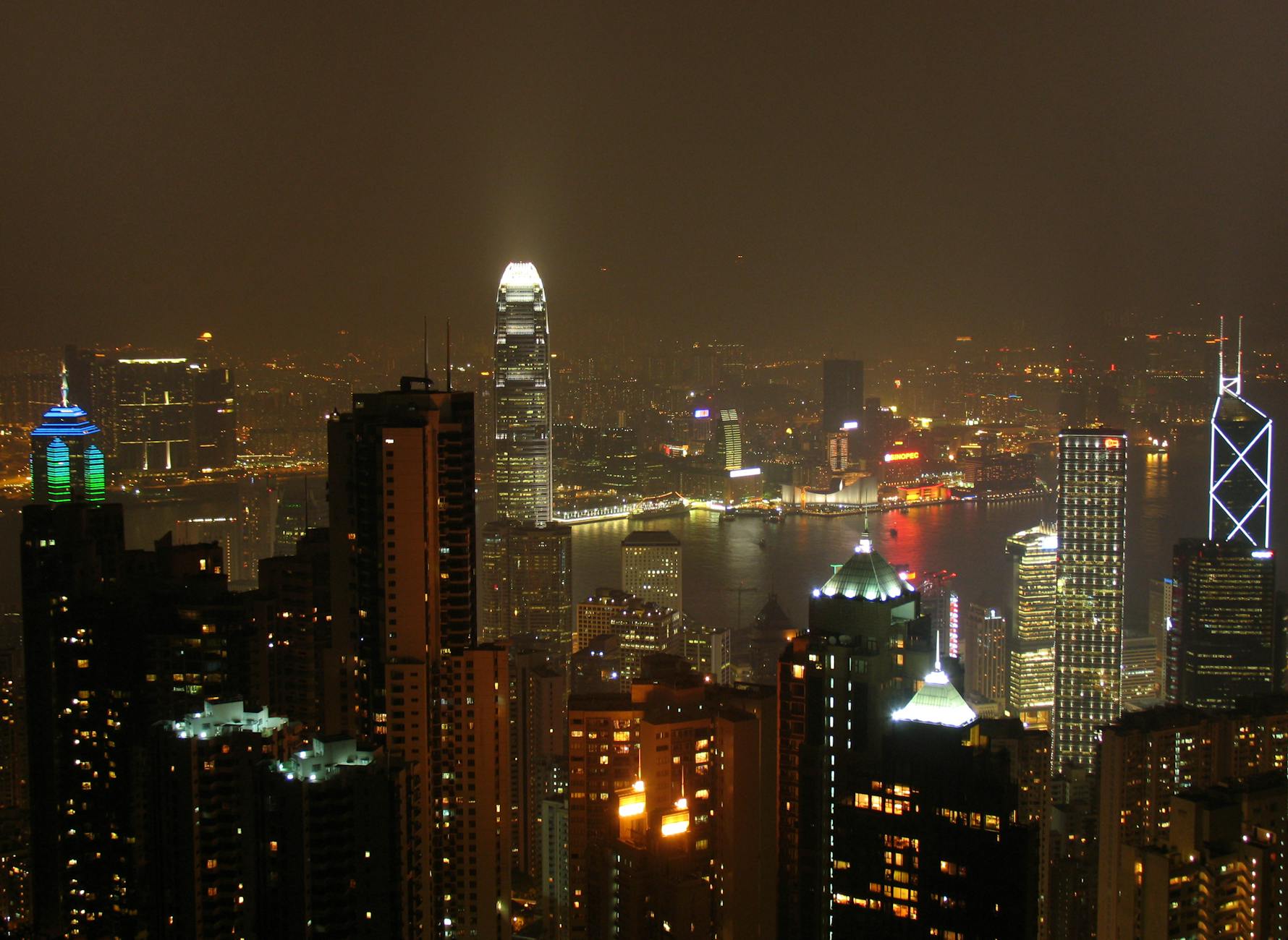 Wan Chai night skyline and older traveler report planning context.