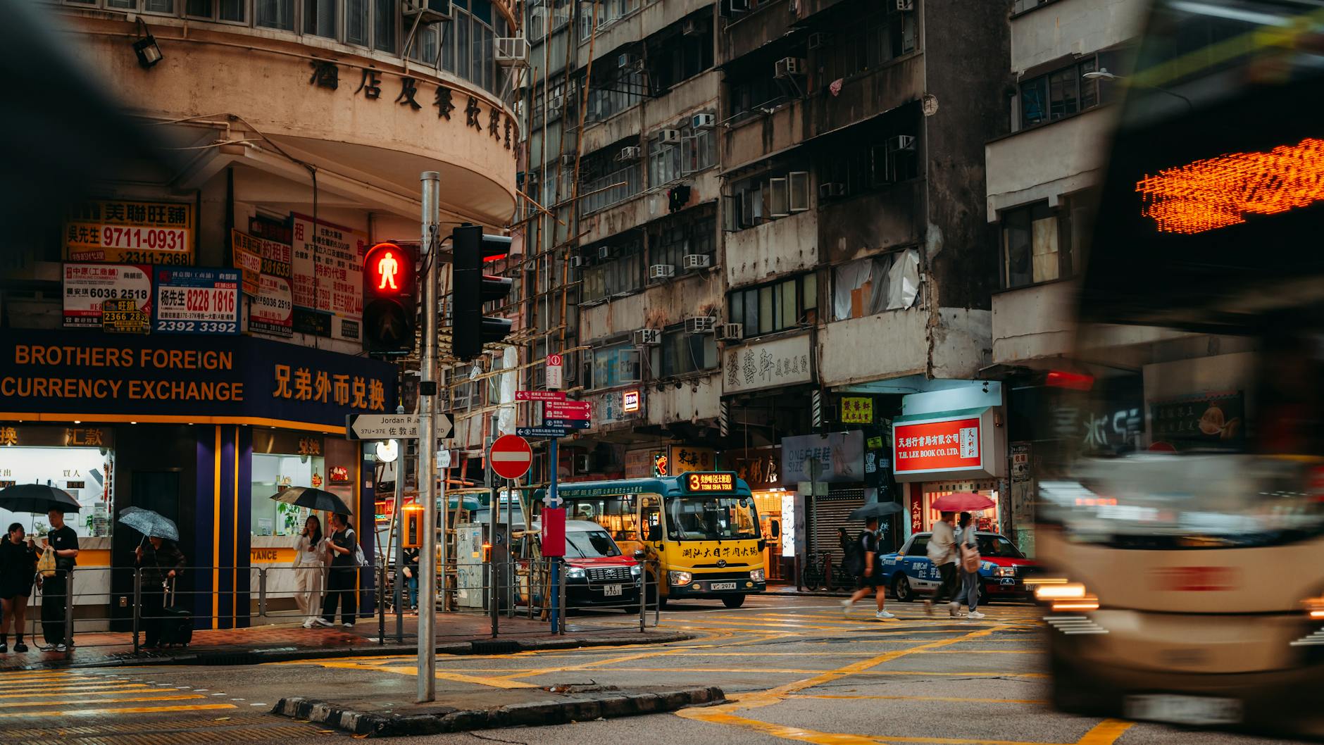 Wan Chai rainy crowded street and repeat leisure planning context.