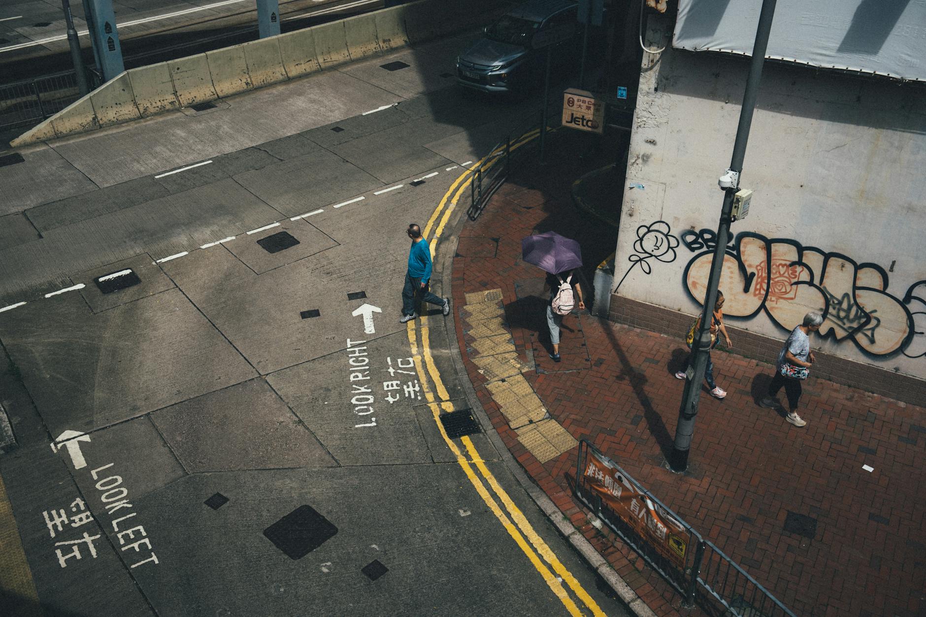 Wan Chai rainy street and student weather support planning context.