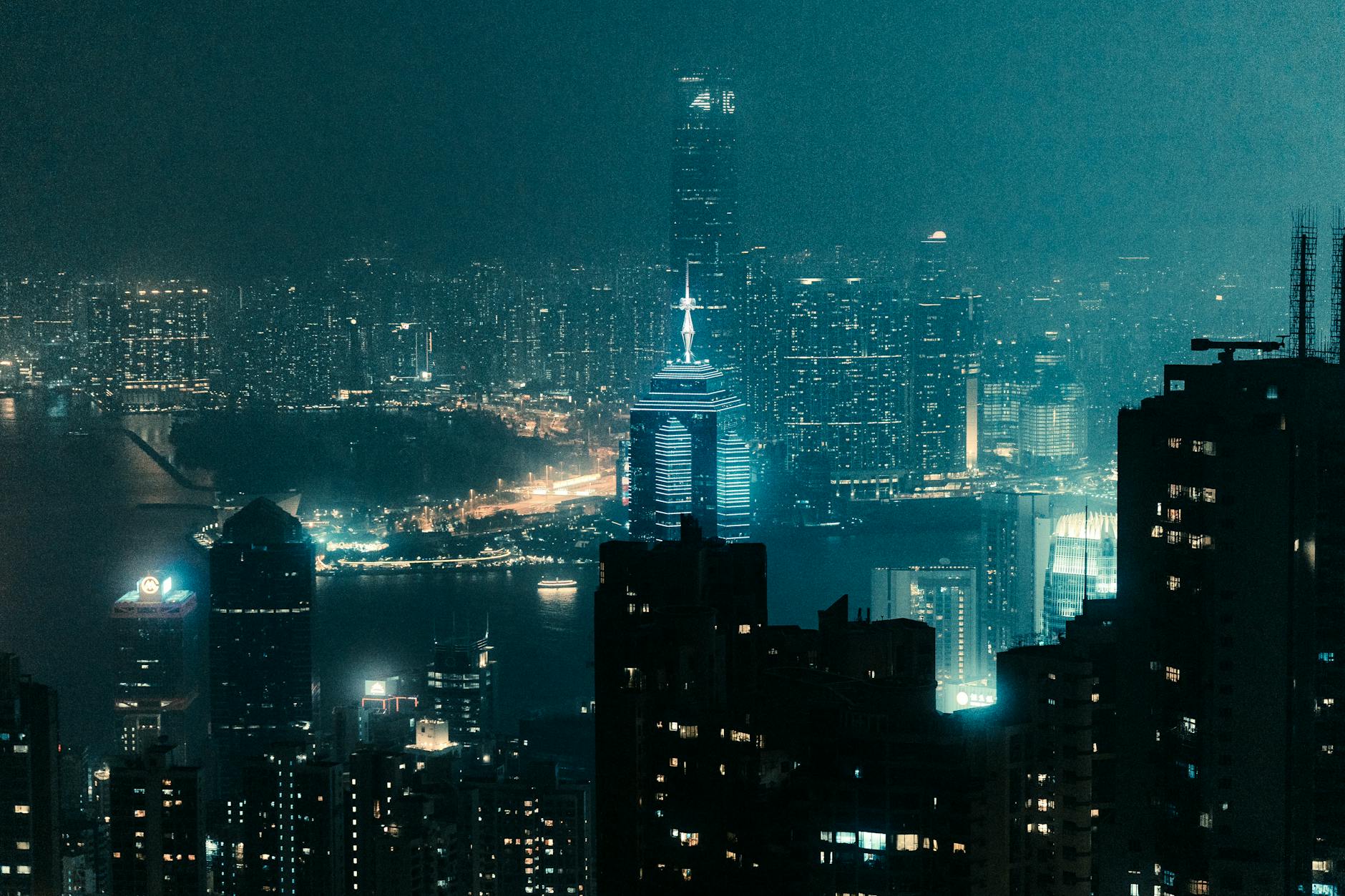 Wan Chai night skyline and woman traveler report planning context.