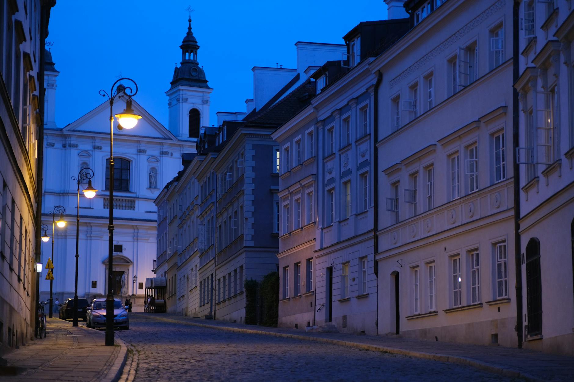 Warsaw old town evening scene for academic conference networking planning.